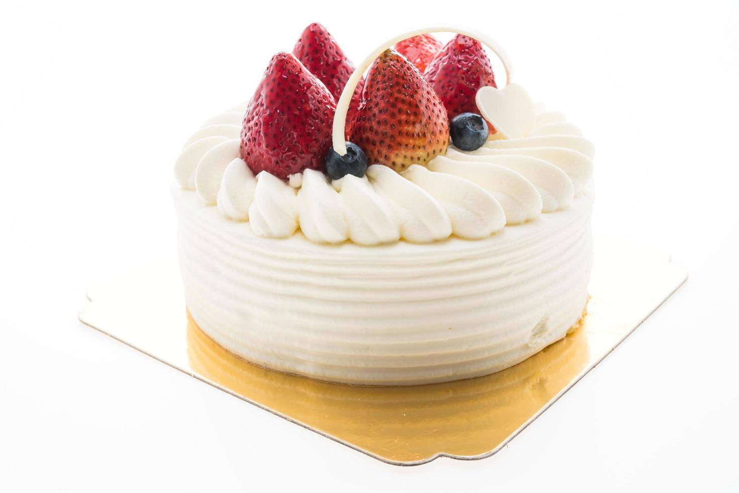 Vanilla cream cake with strawberry on top photo