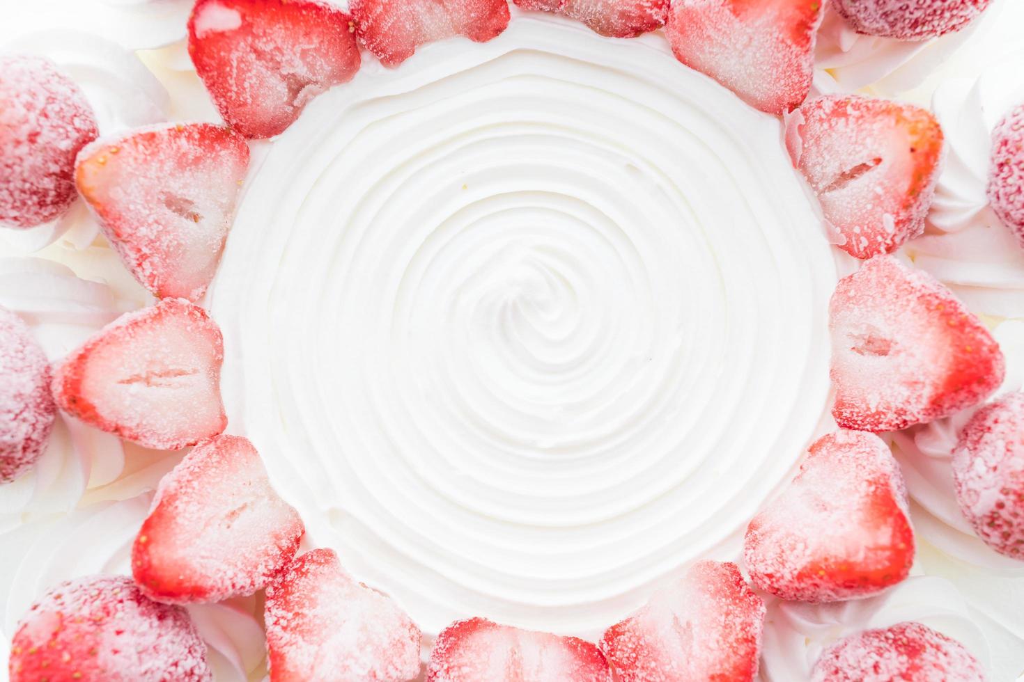 Vanilla ice cream cake with strawberry on top photo