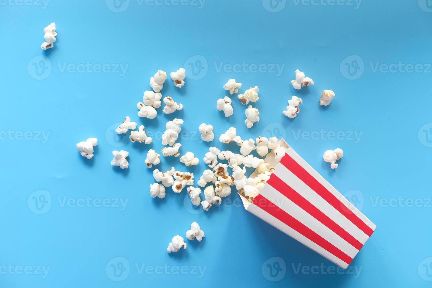 Popcorn on blue background photo