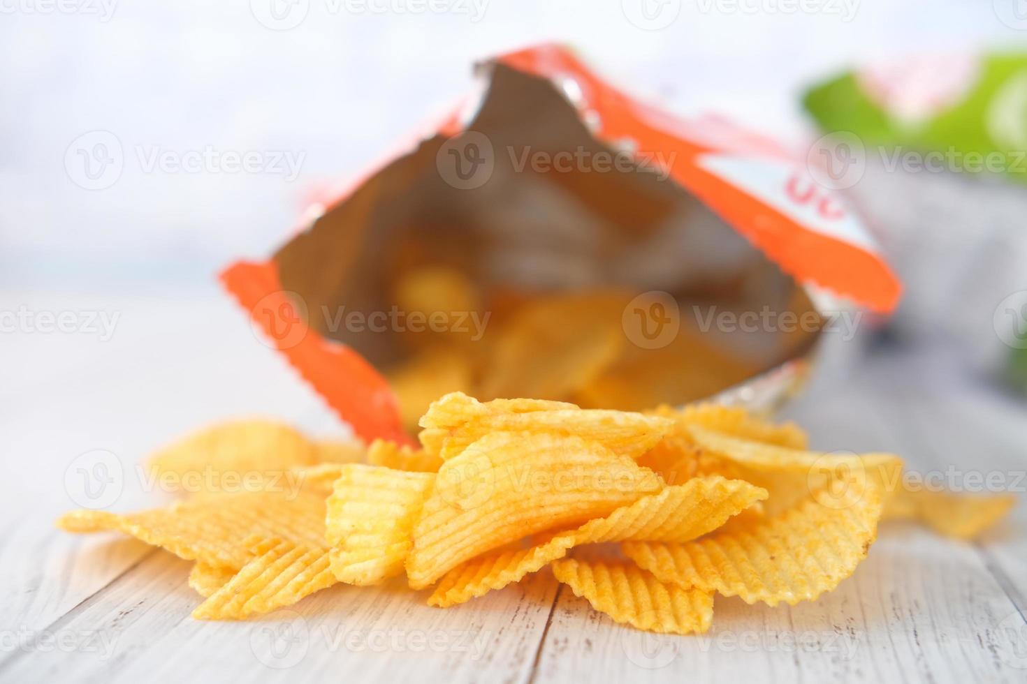 Potato chips in orange bag photo