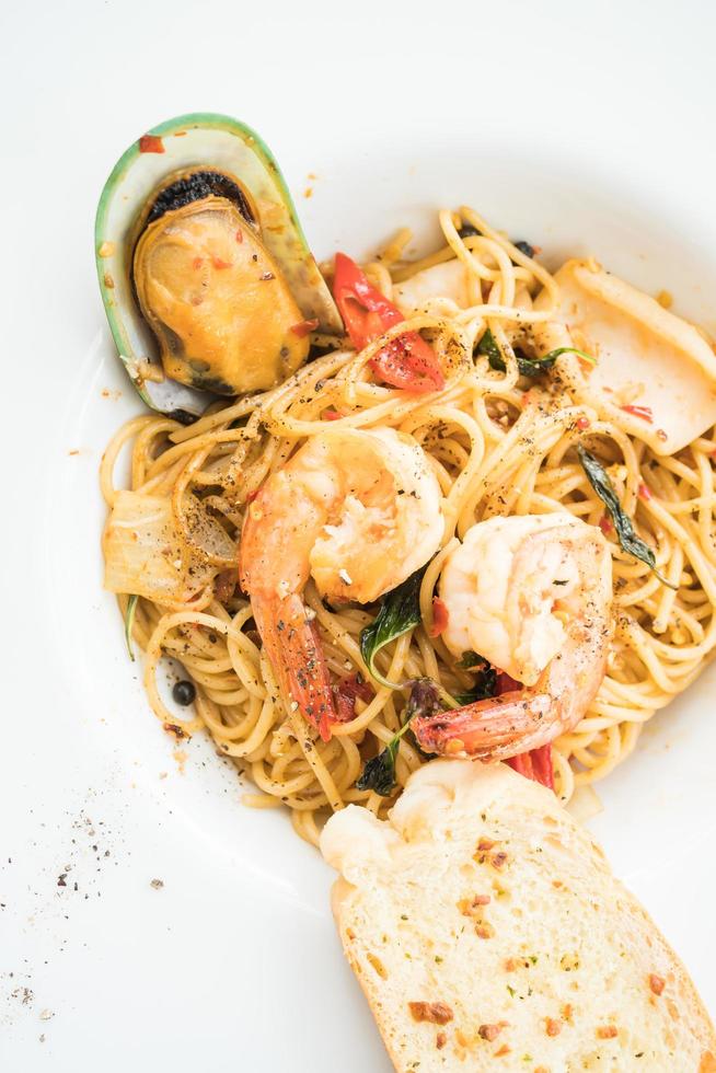 Spaghetti seafood in white plate photo