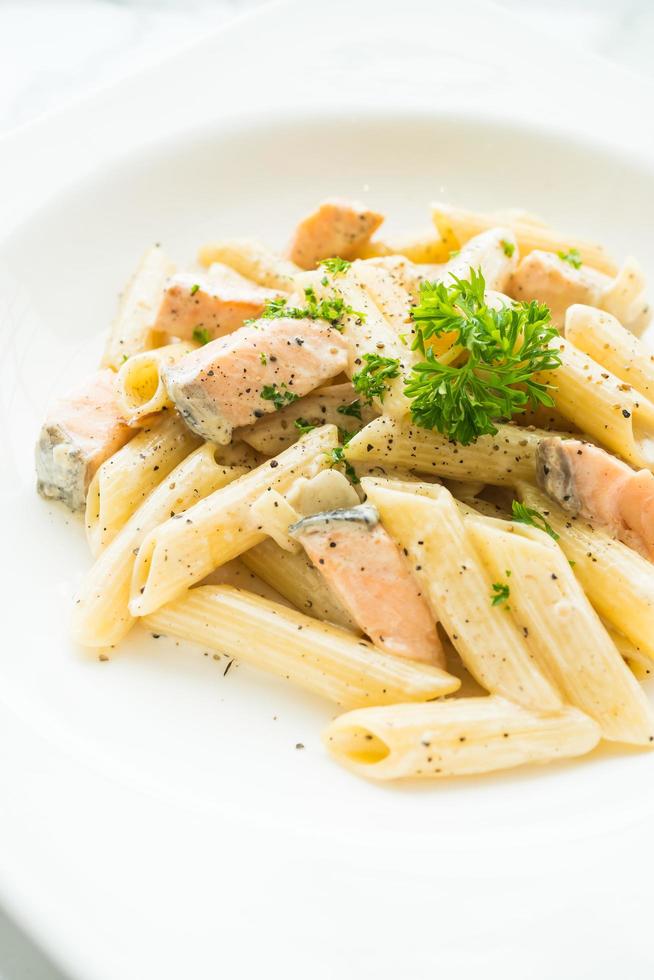 Penne carbonara pasta with salmon photo
