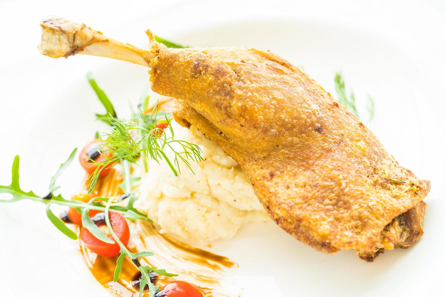 Fried duck leg with potato salad photo