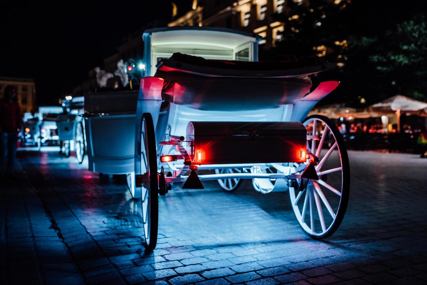 Krakow, Poland 2017- The old square of the night in Krakow with horse-drawn carriages photo