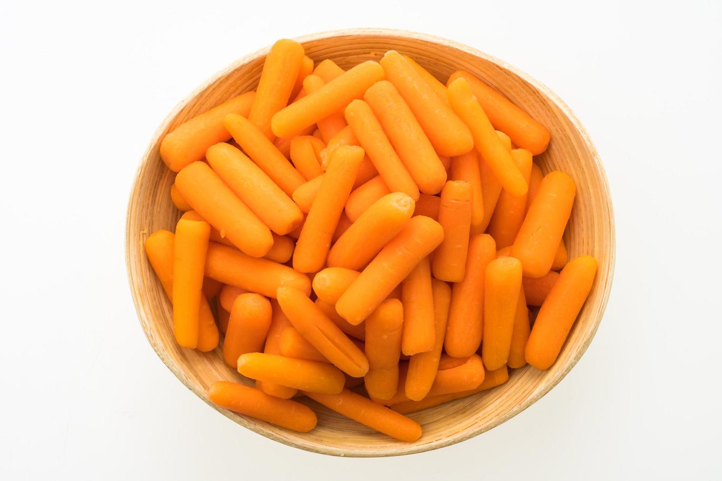 Baby carrot in wooden bowl photo