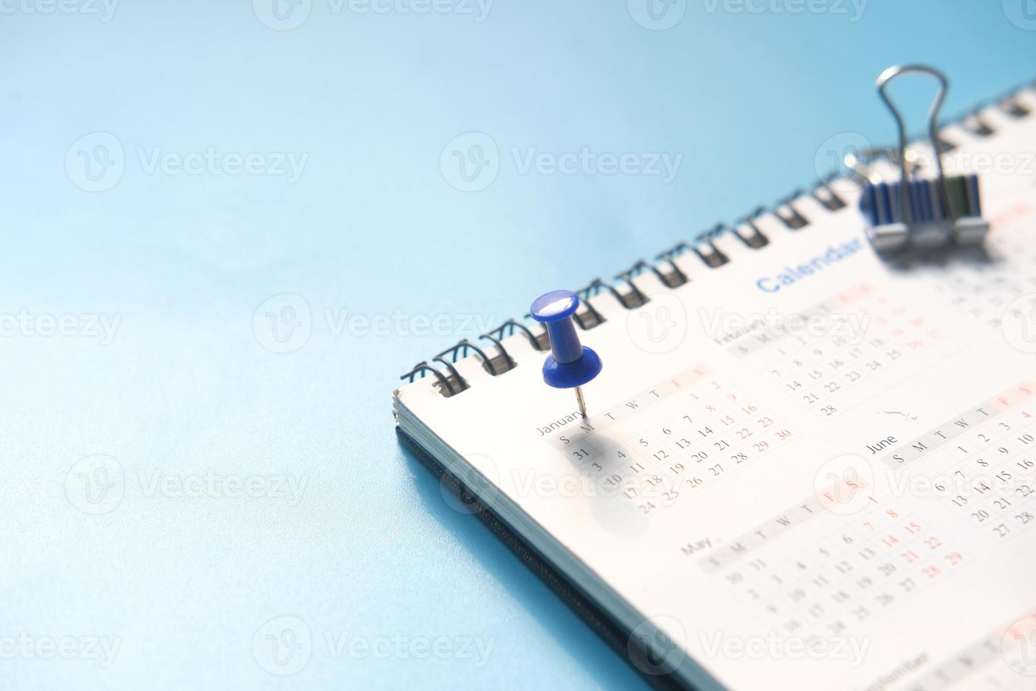 Push pin on January calendar date photo