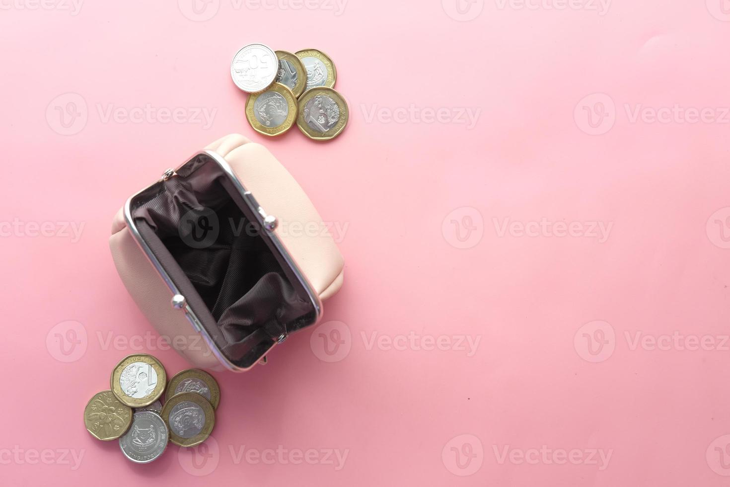 Top view of coins in a small leather bag photo