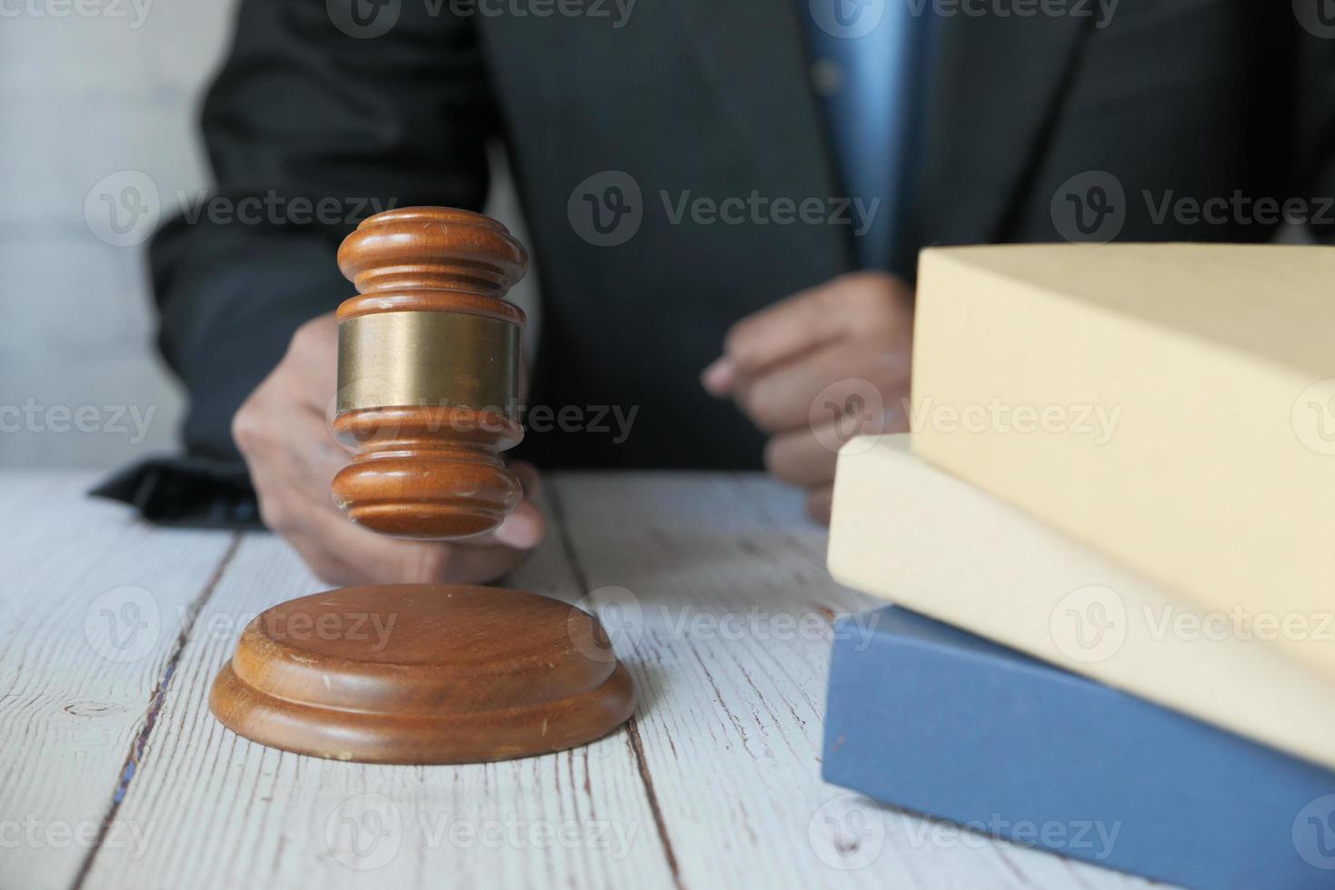 Person striking the gavel photo