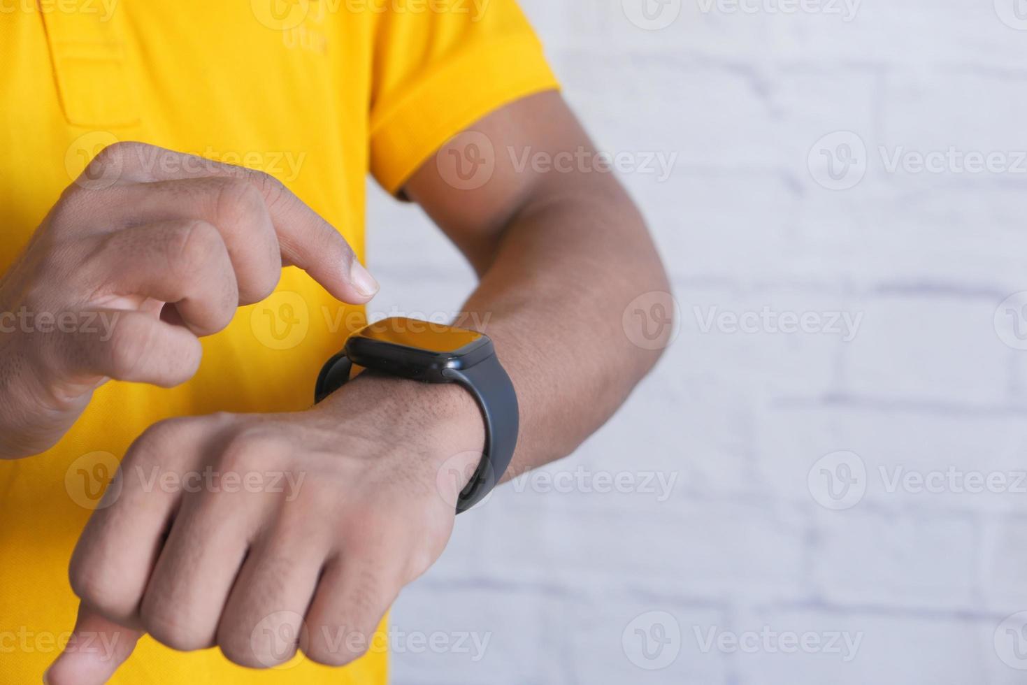 Man using smart watch photo
