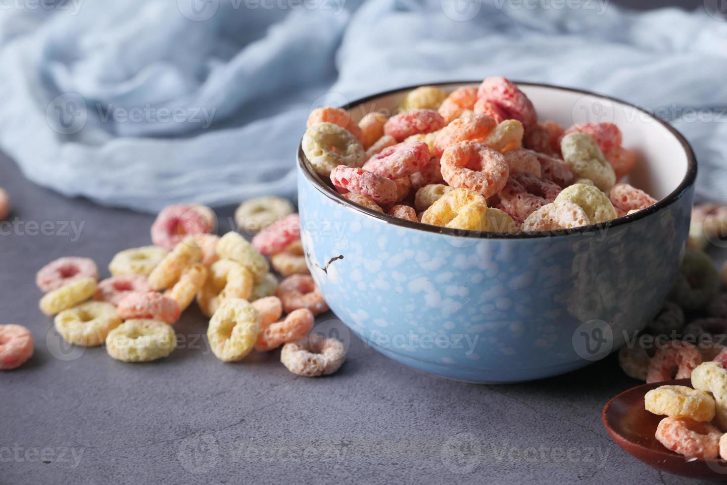 Colorful cereal in blue bowl photo