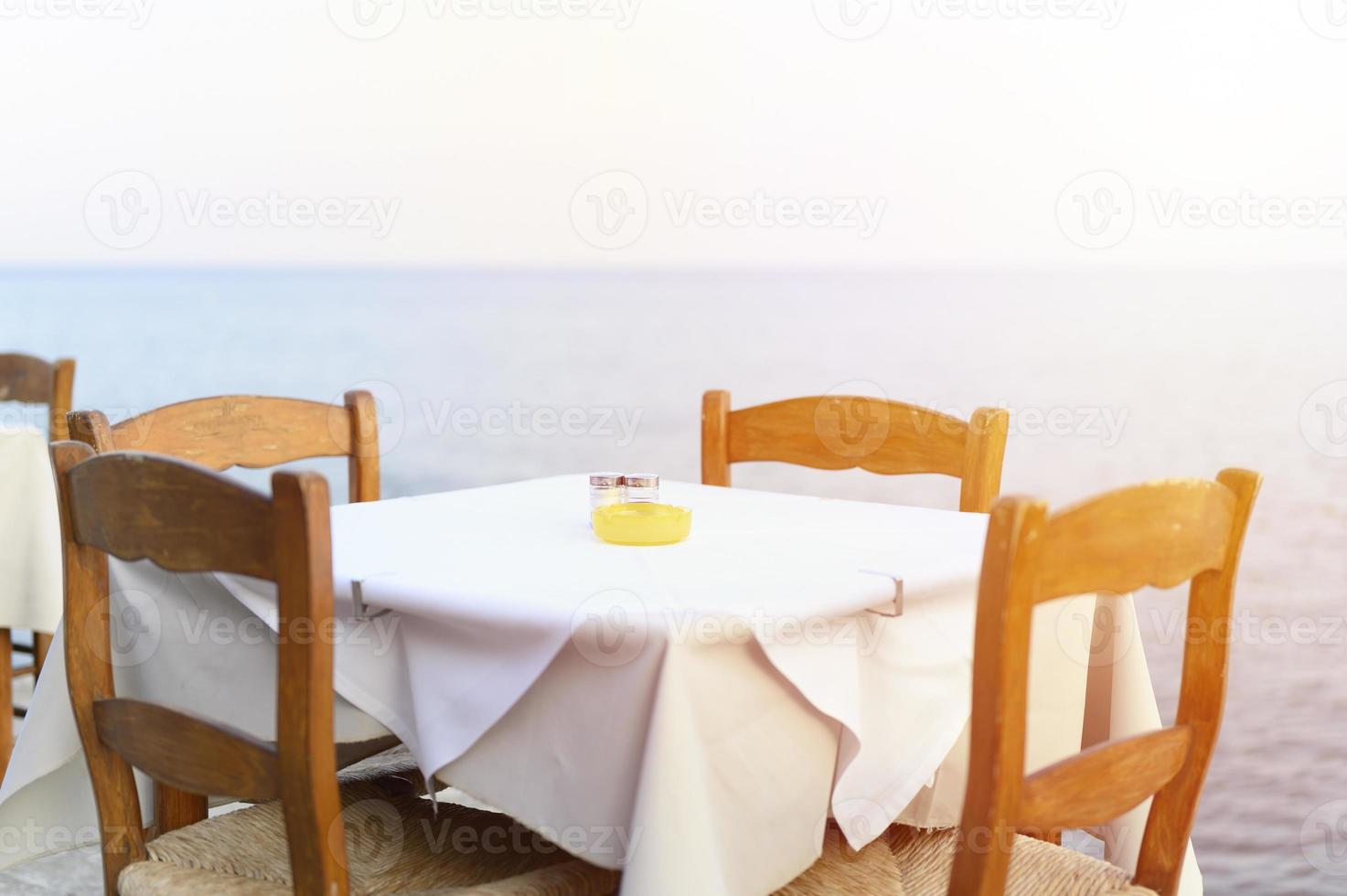 Cafe tables on the sea, selective focus photo