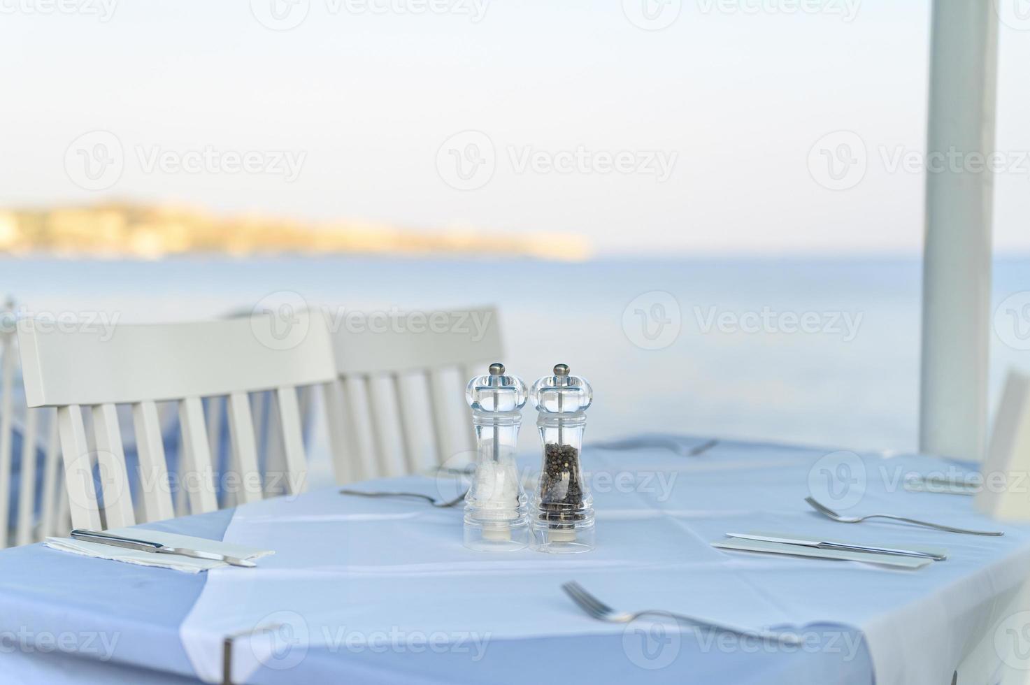 Cafe tables on the sea, selective focus photo