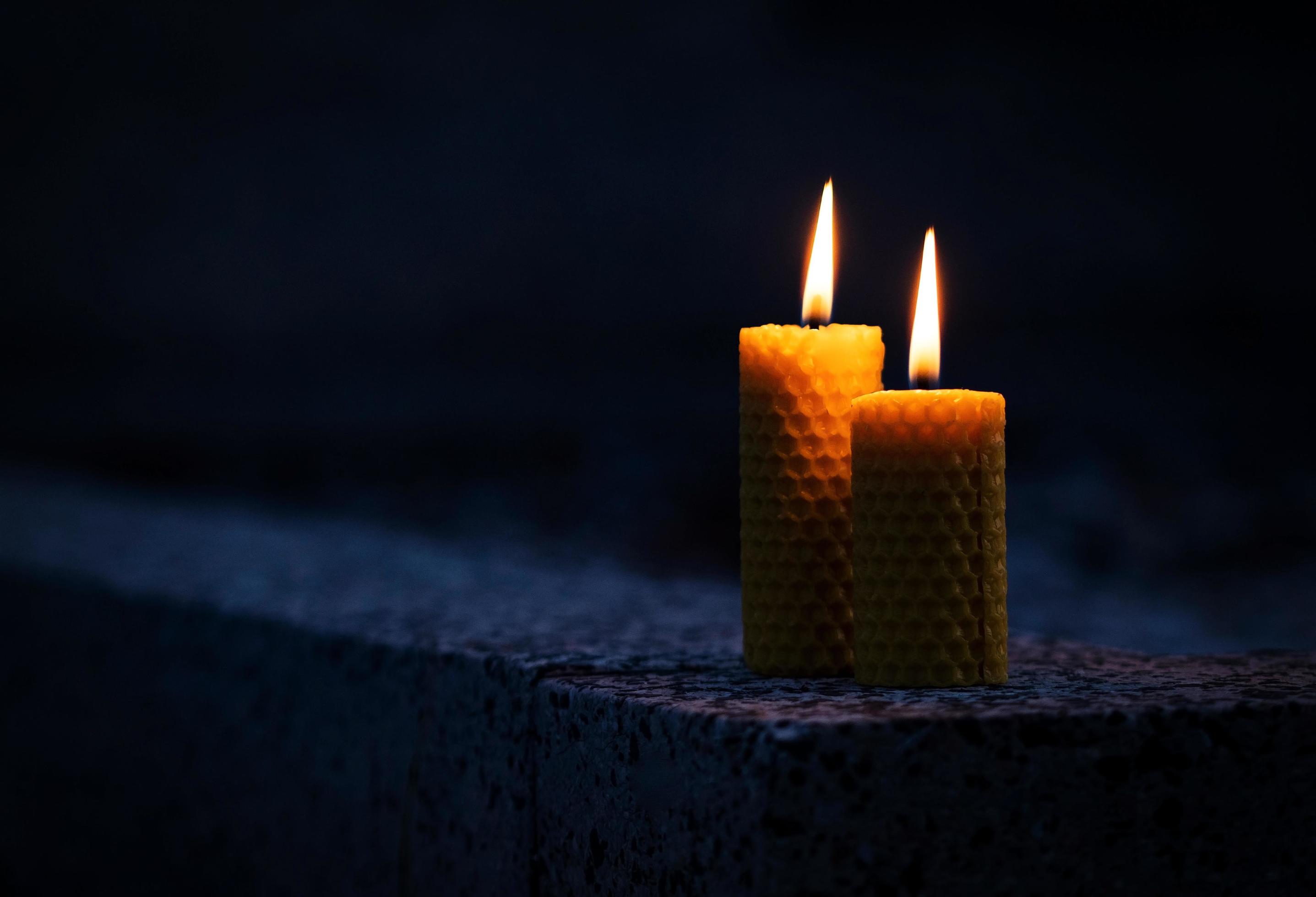 Two candles in the dark 2175368 Stock Photo at Vecteezy