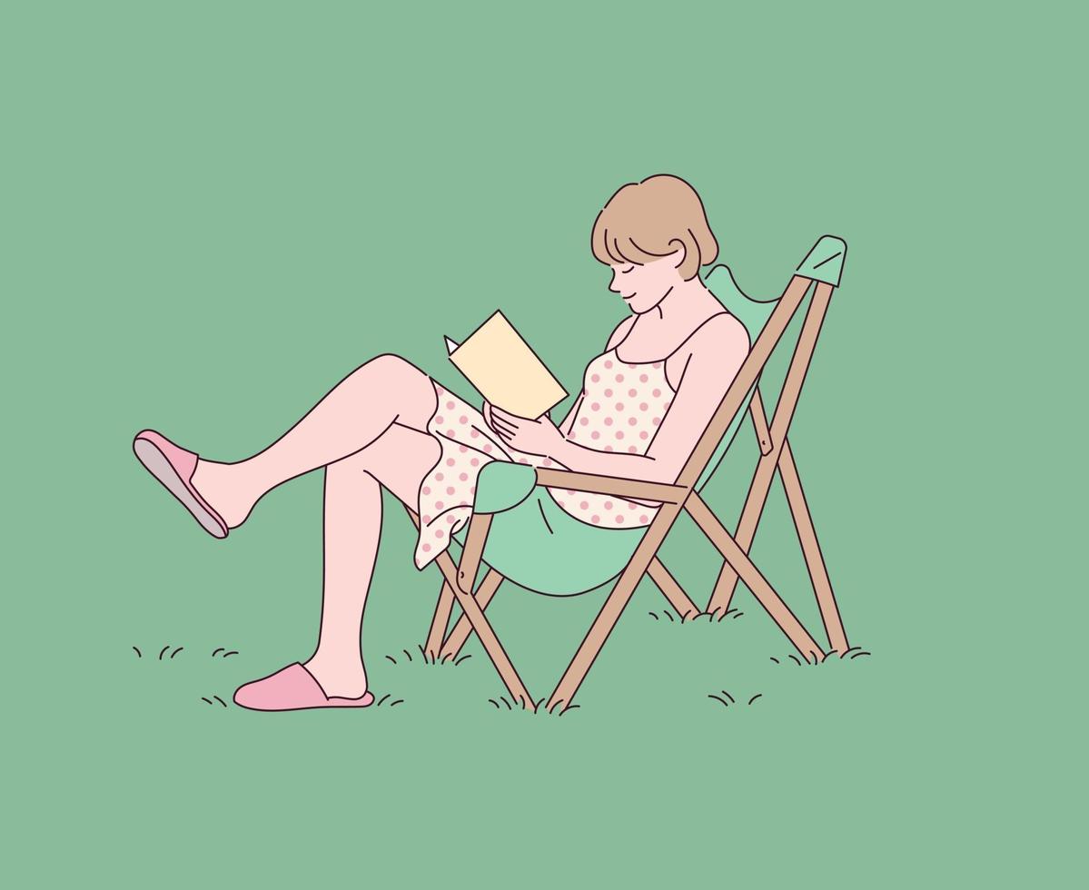 A girl is reading a book with a chair on the lawn. vector