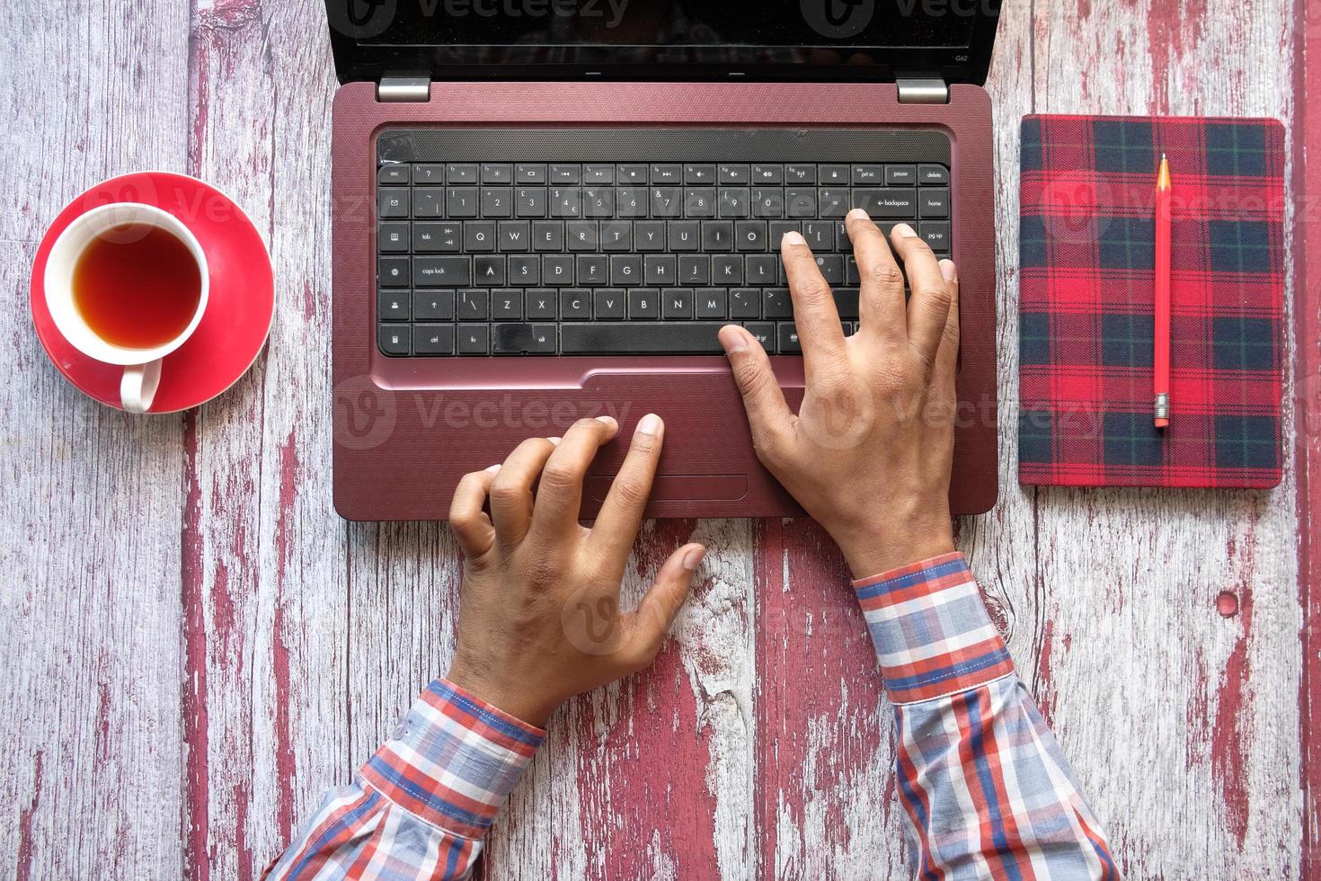 Top view of person typing on keyboard photo