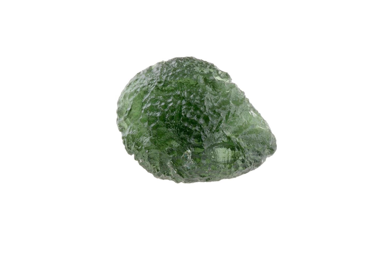 Round Czech moldavite isolated on a white background photo