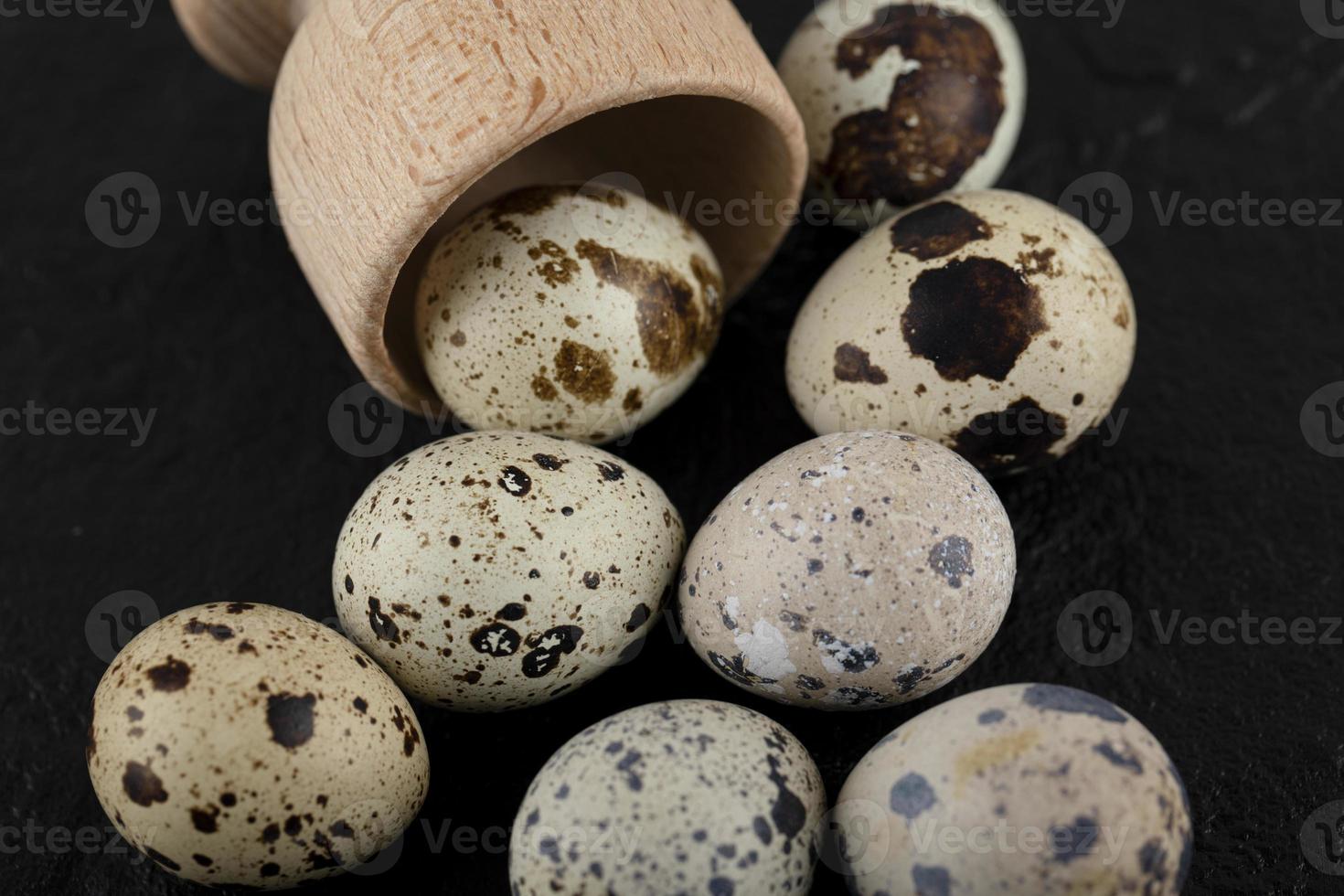 Fresh farm quail eggs out of wooden box photo