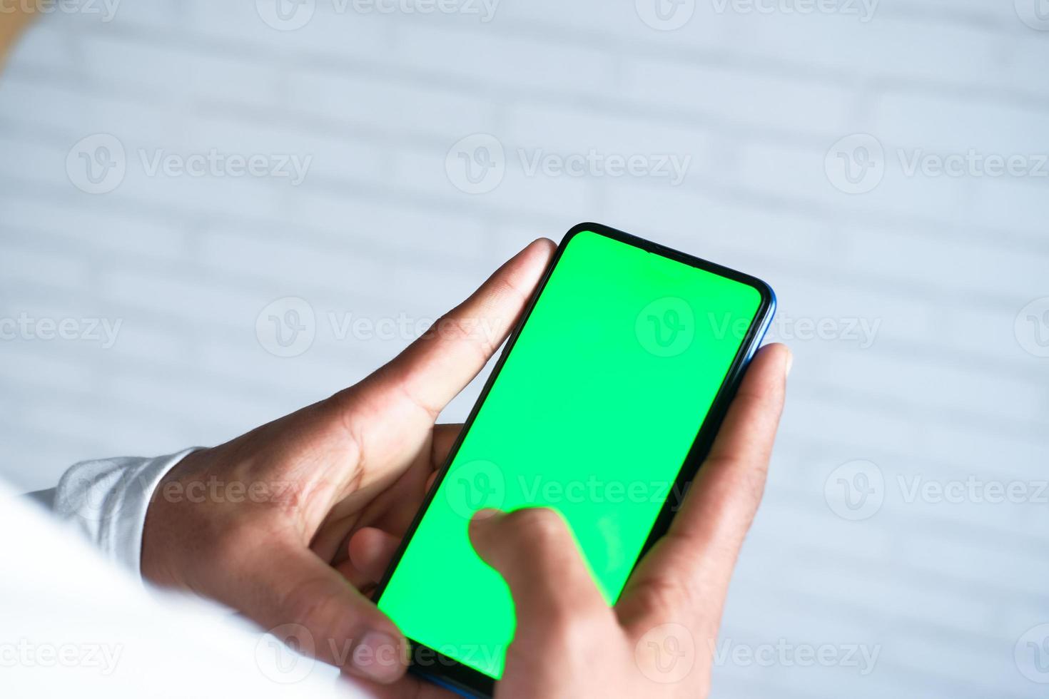 Man using mock up smart phone photo