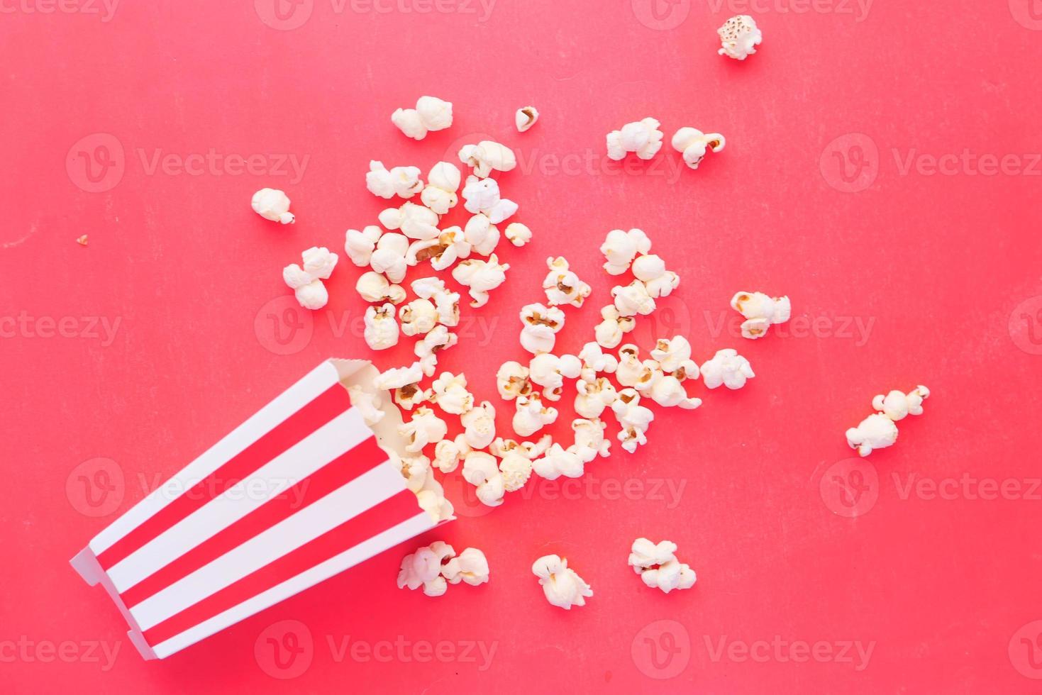 Popcorn on a red background photo
