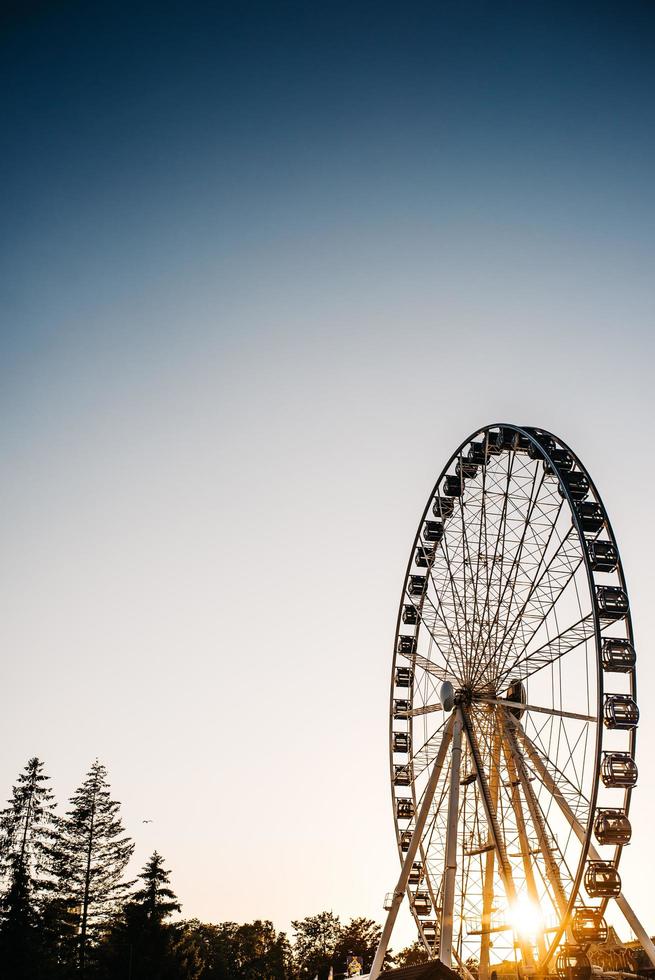 Ferris wheel against the blue sky photo