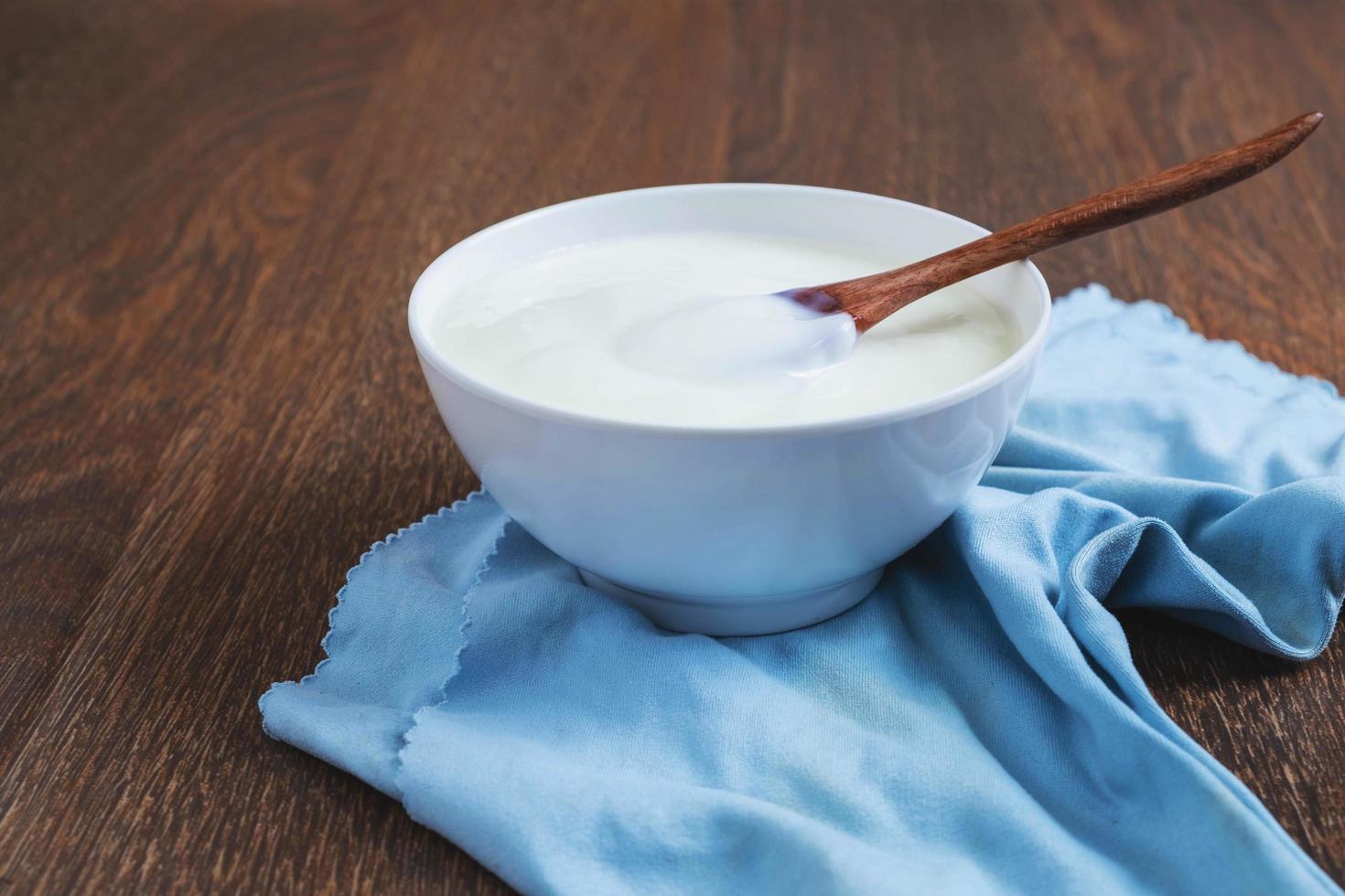 Bowl of yogurt on cloth photo