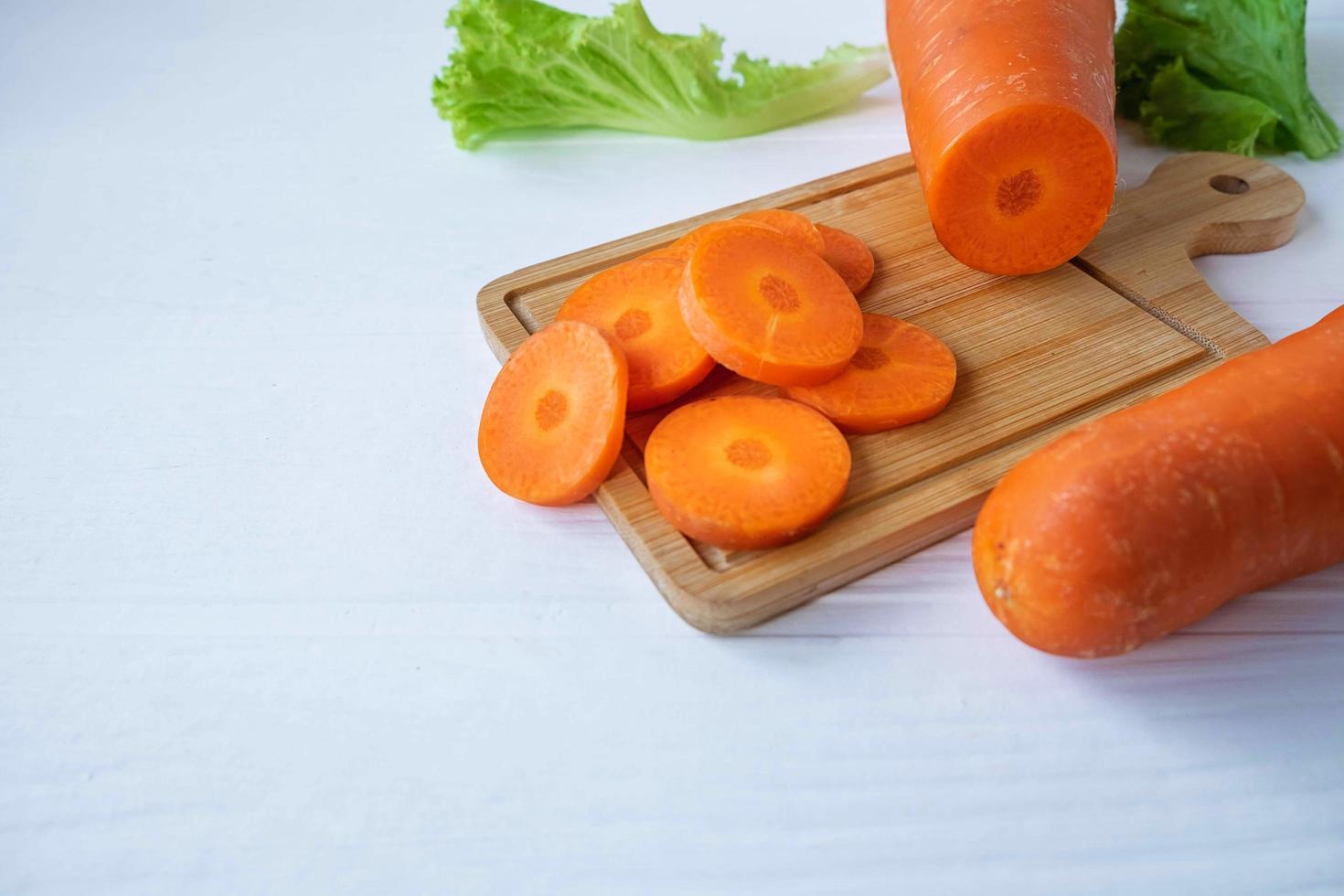 Sliced carrots on a board photo