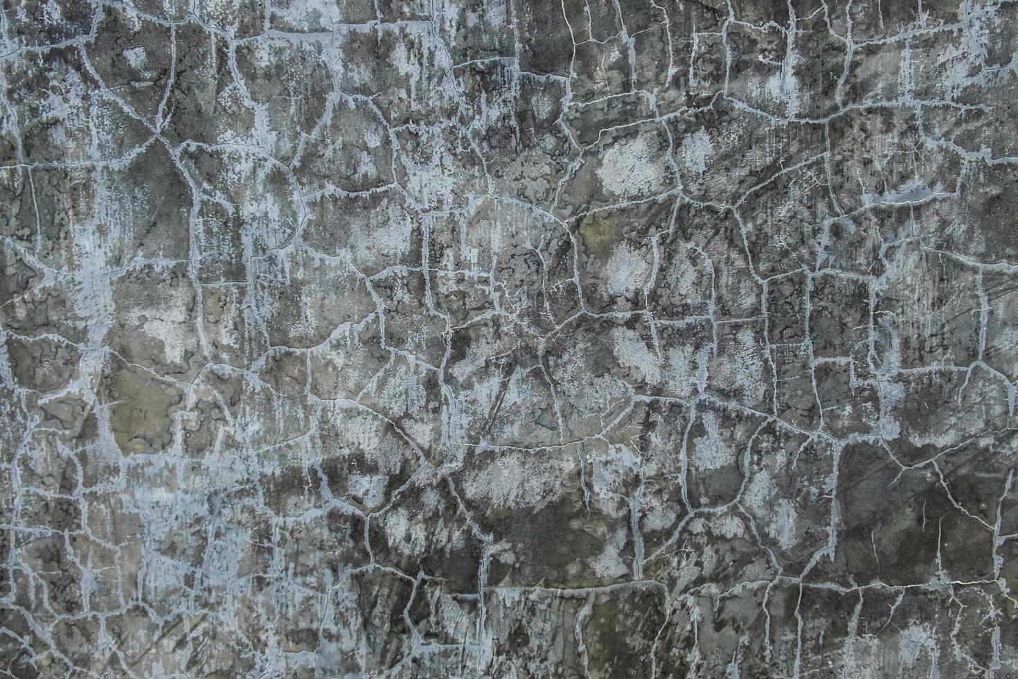 Cracked dark concrete photo