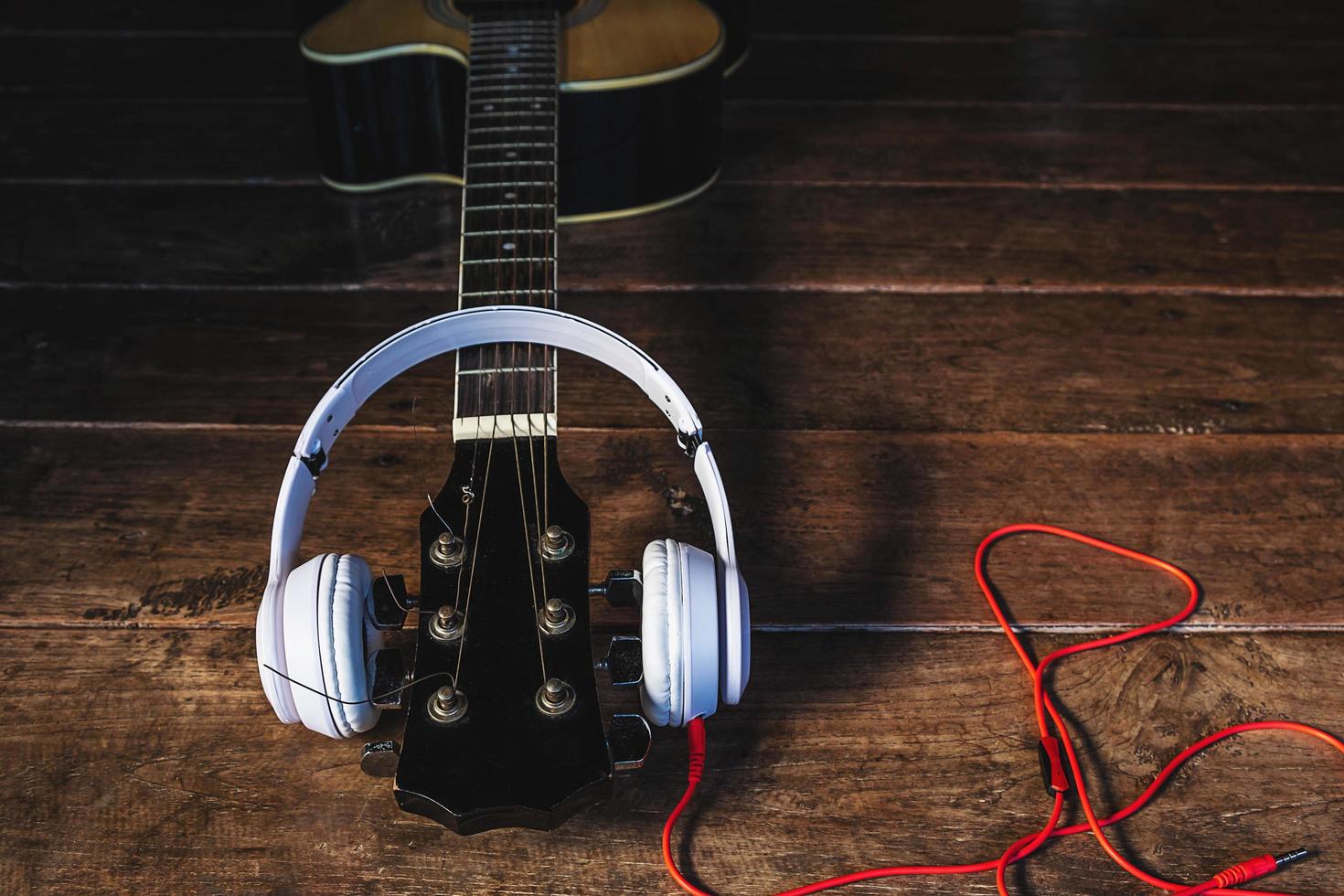 Headphones on a guitar neck photo