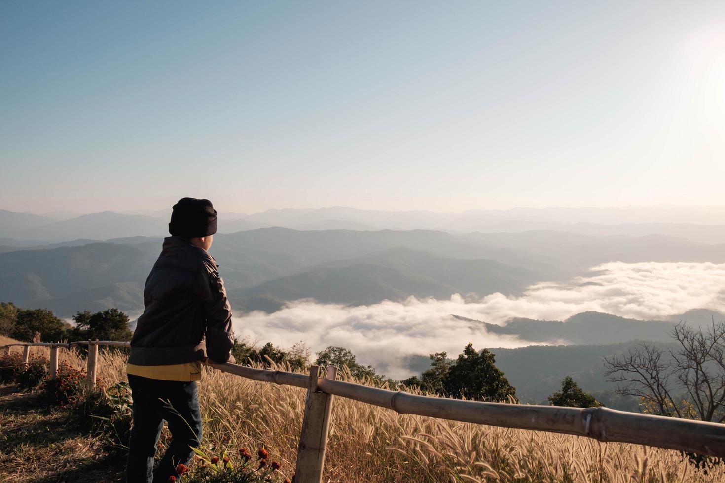 Woman looking out towards scenic view photo