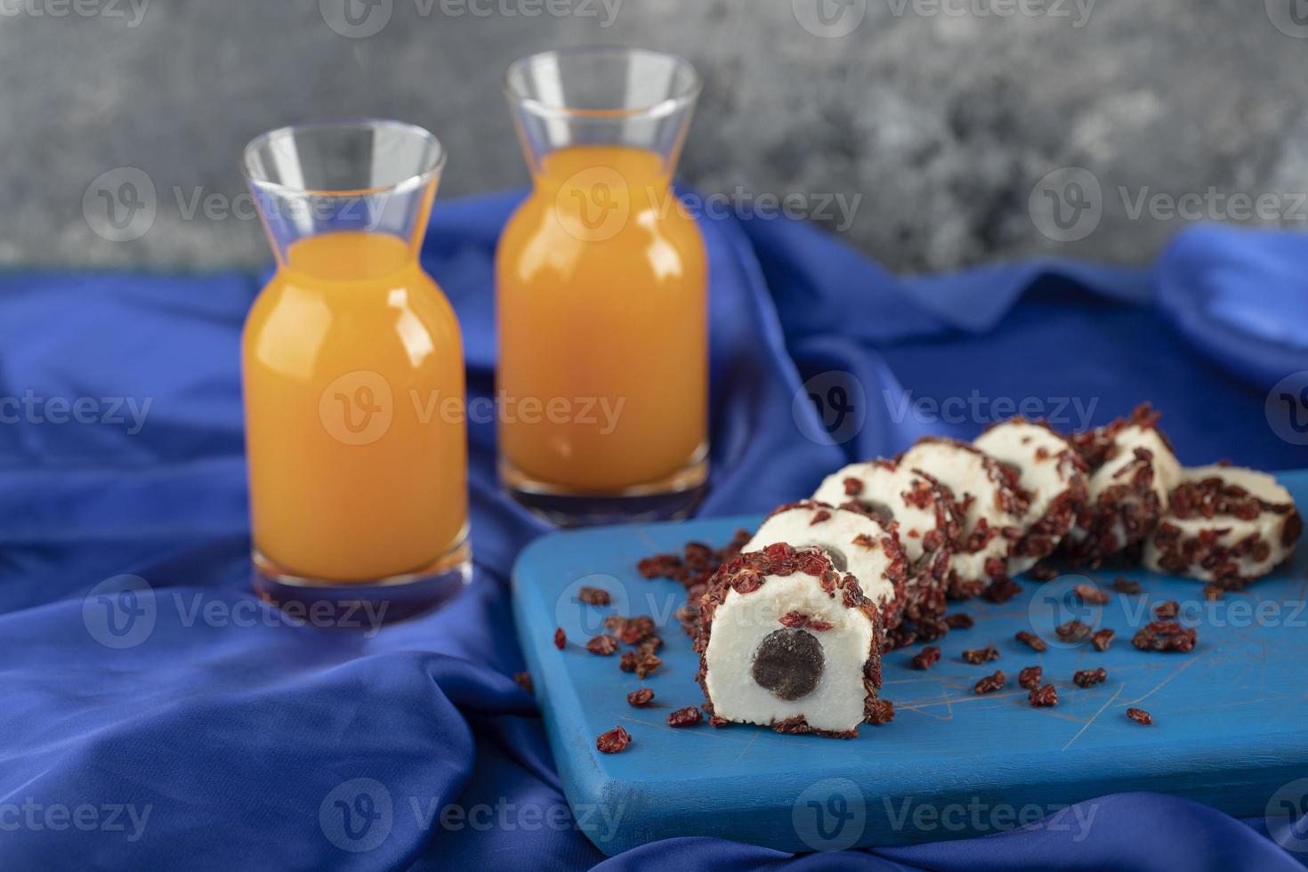 Two glass pitchers with delicious orange juice photo