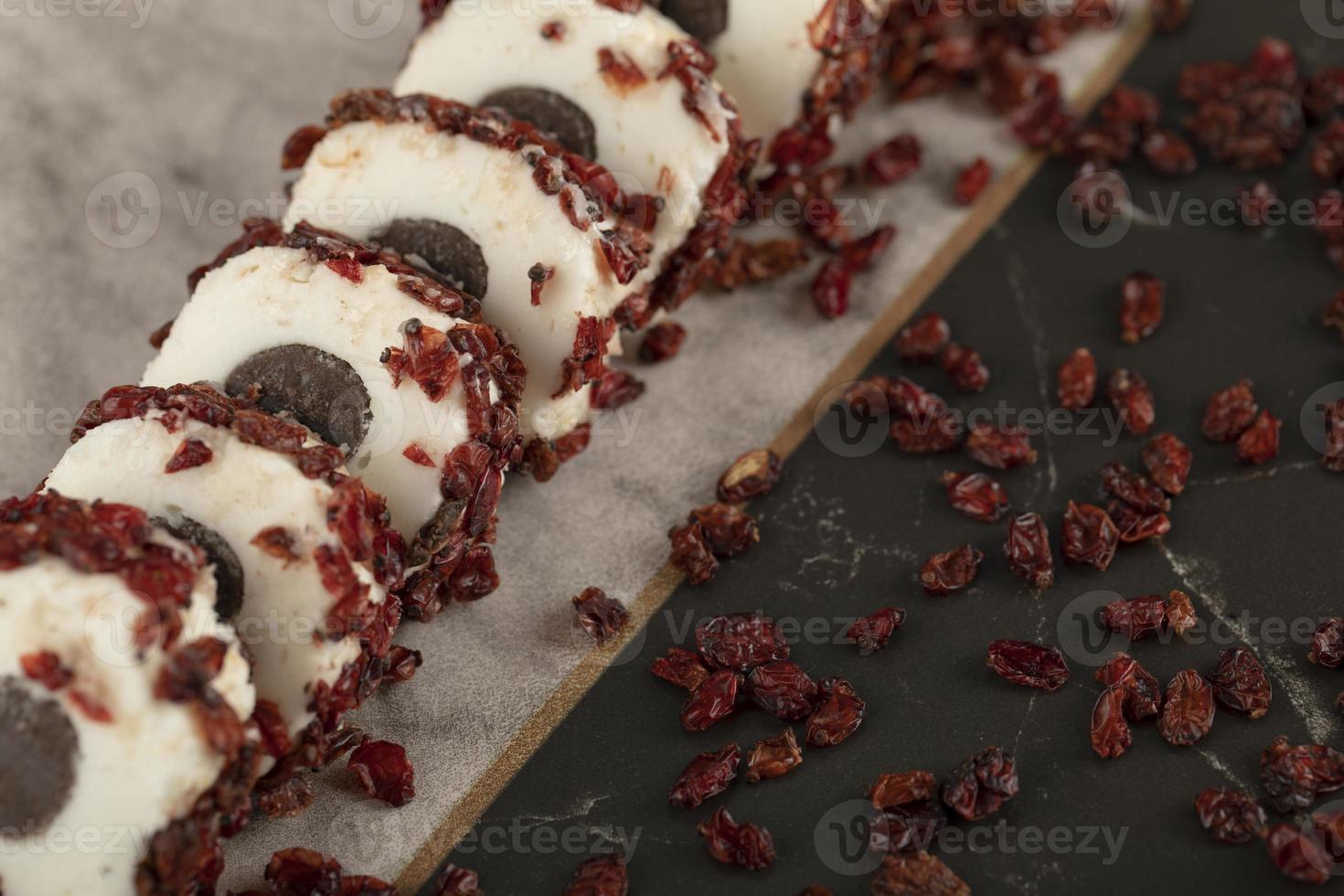 Sweet sliced dessert with dried fruit on a plate photo