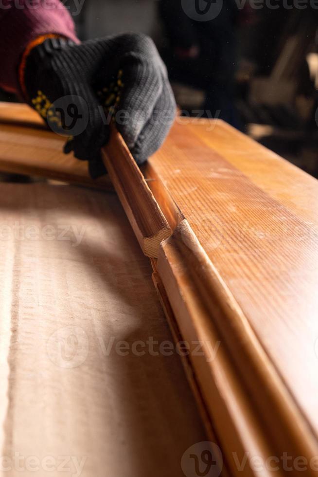 Carpenter restoring wooden doors photo