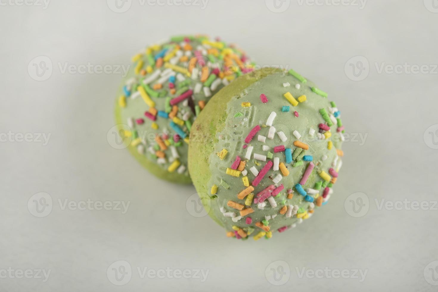 Colorful sweet green chocolate small doughnuts photo