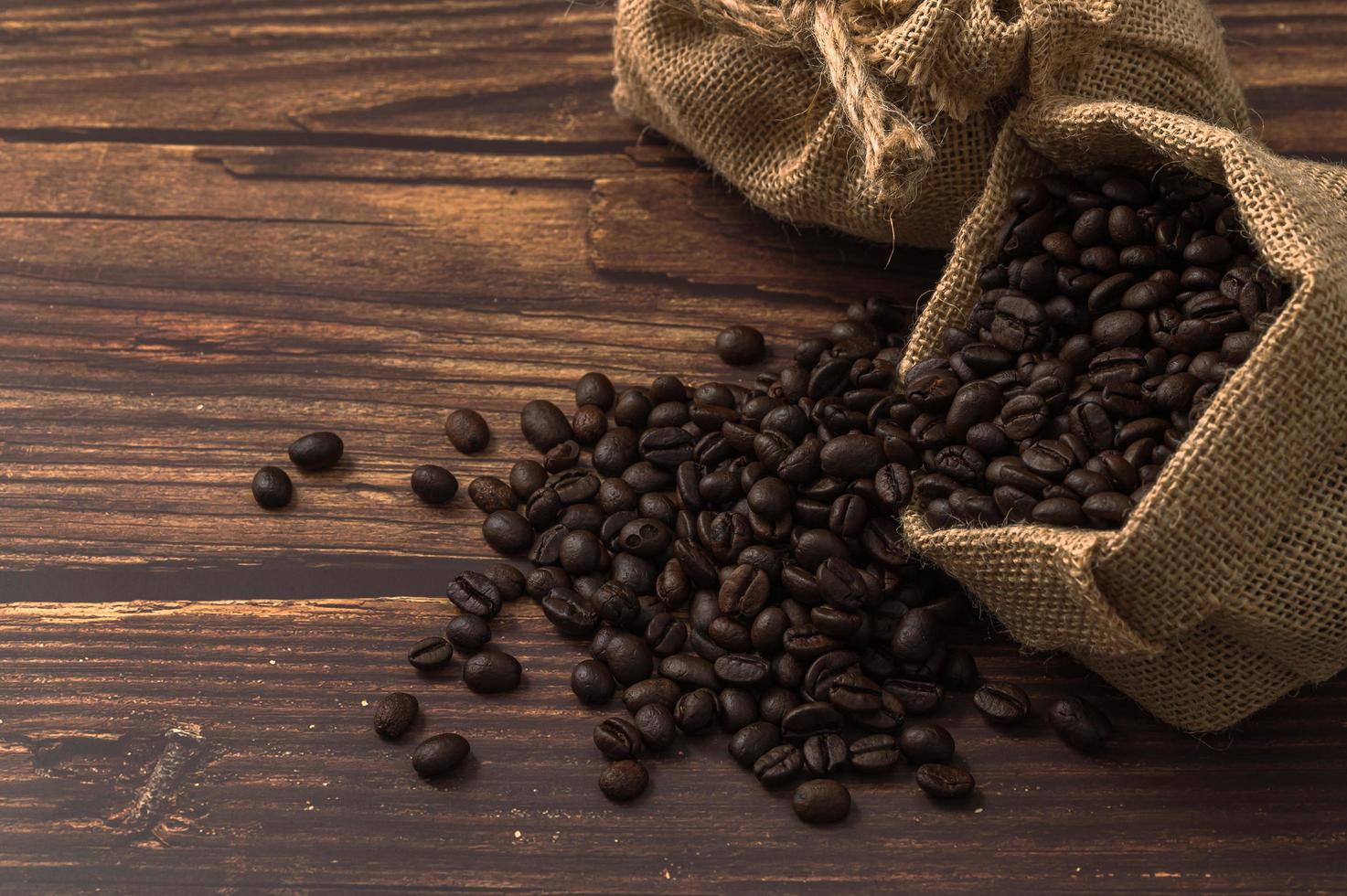 Coffee beans on a wooden table, love drinking coffee concept photo