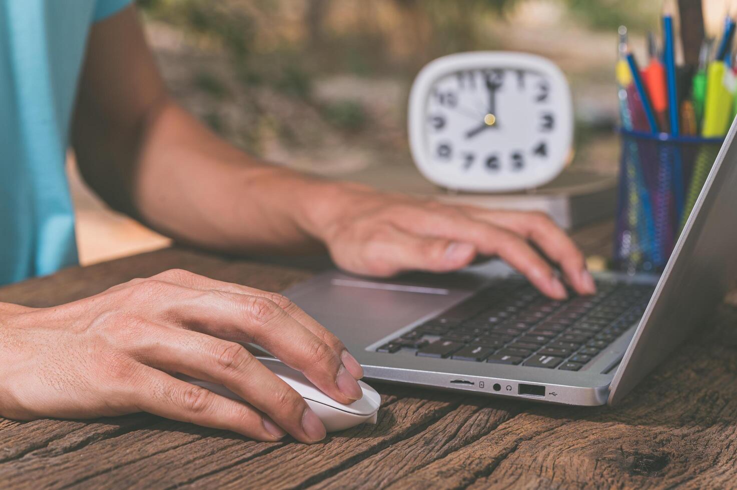 A person's hands using a notebook computer photo