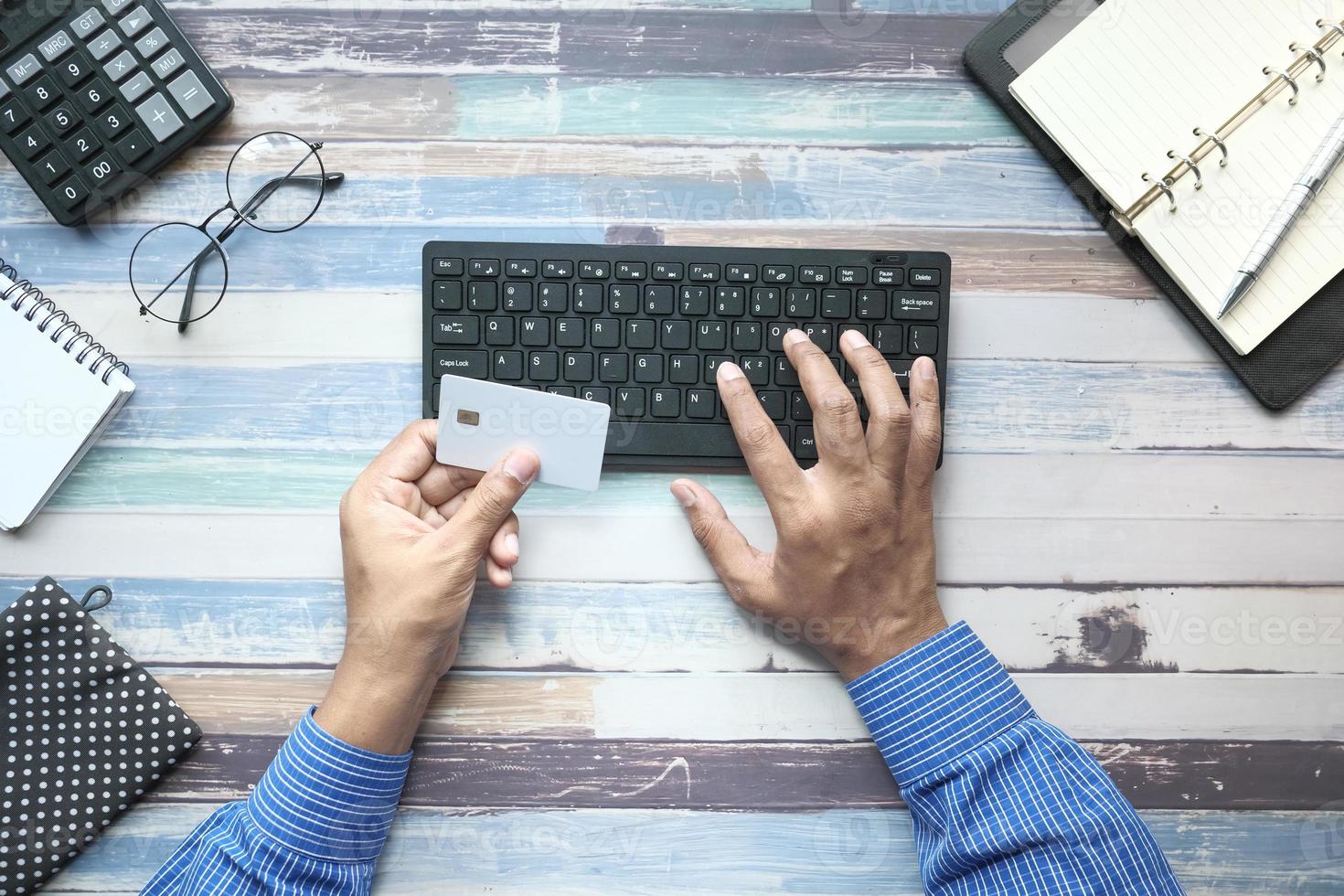 Man shopping online with a credit card photo