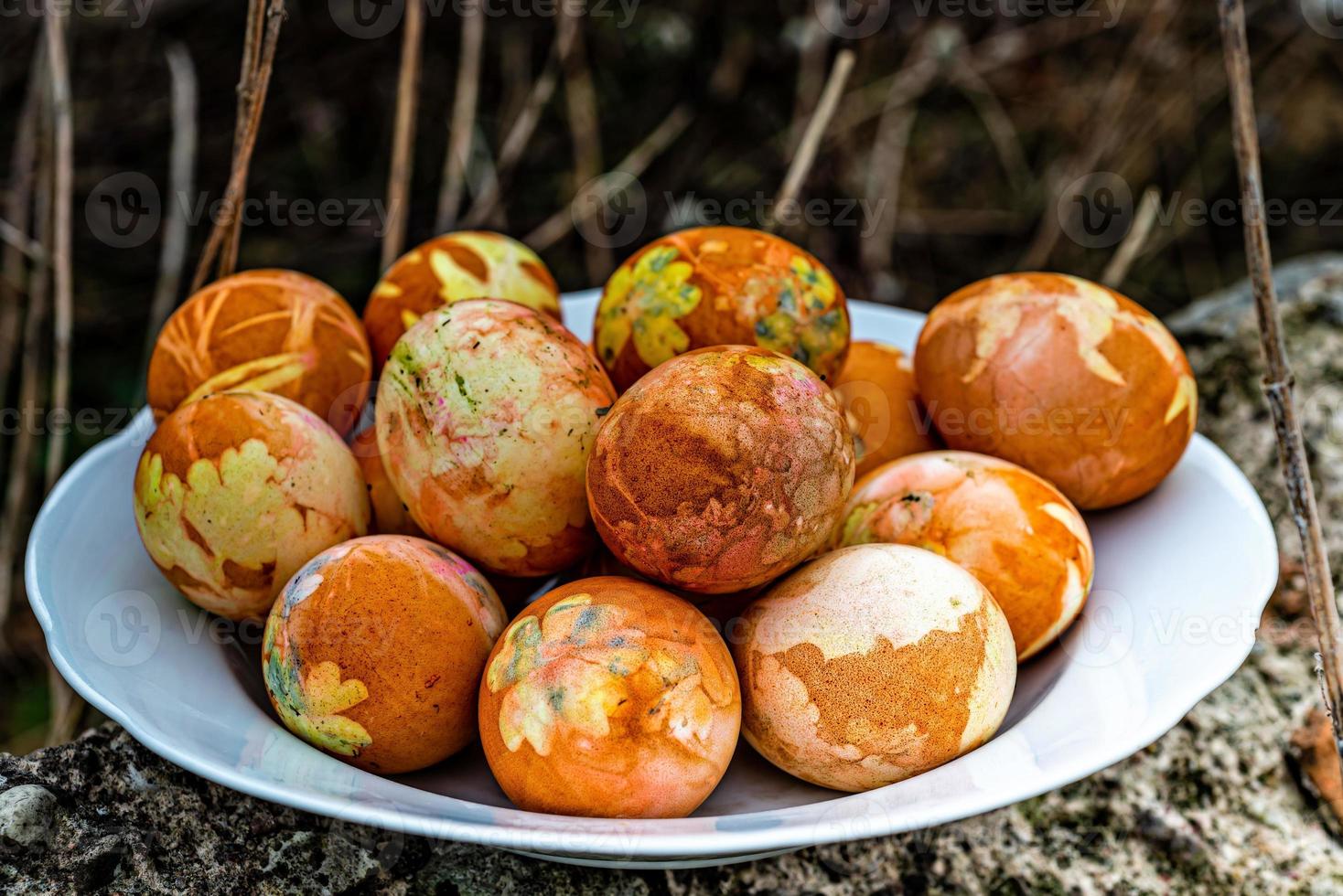 White plate with colored Easter eggs photo