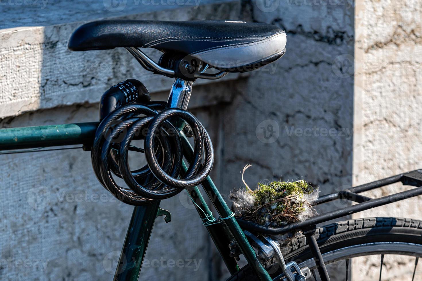 A bird nest, collected from the forest sits on a bike carrier photo