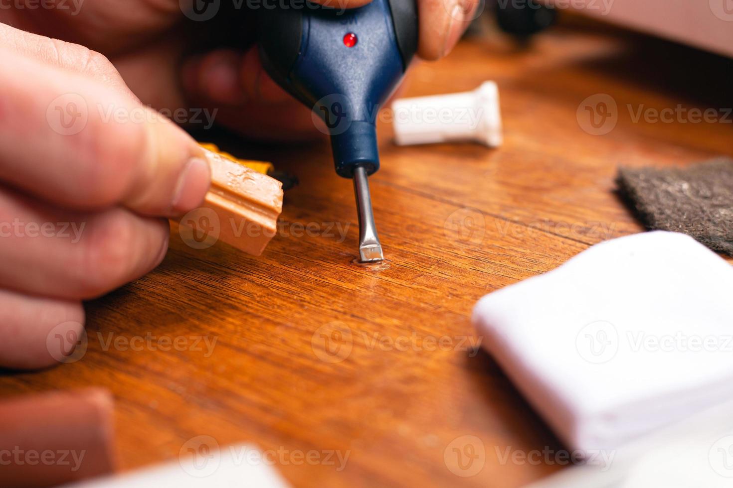 Person restoring laminate photo