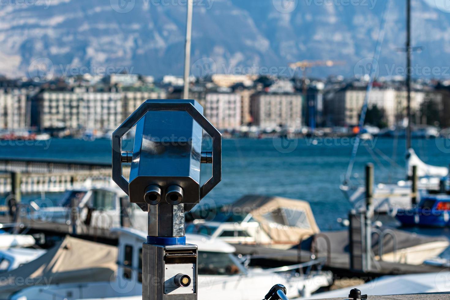 Tourist binoculars on the shores of Lake Geneva in Switzerland photo