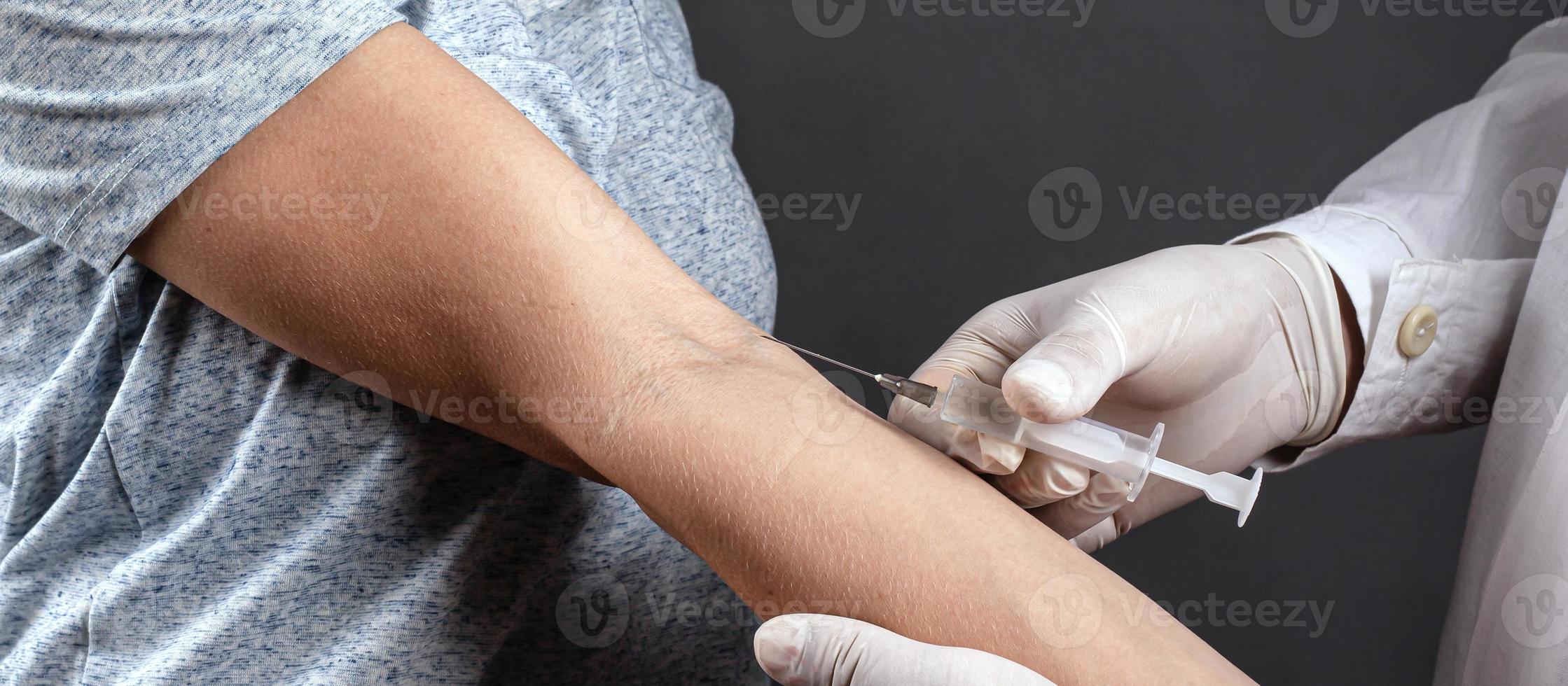 Person receiving a vaccine shot photo