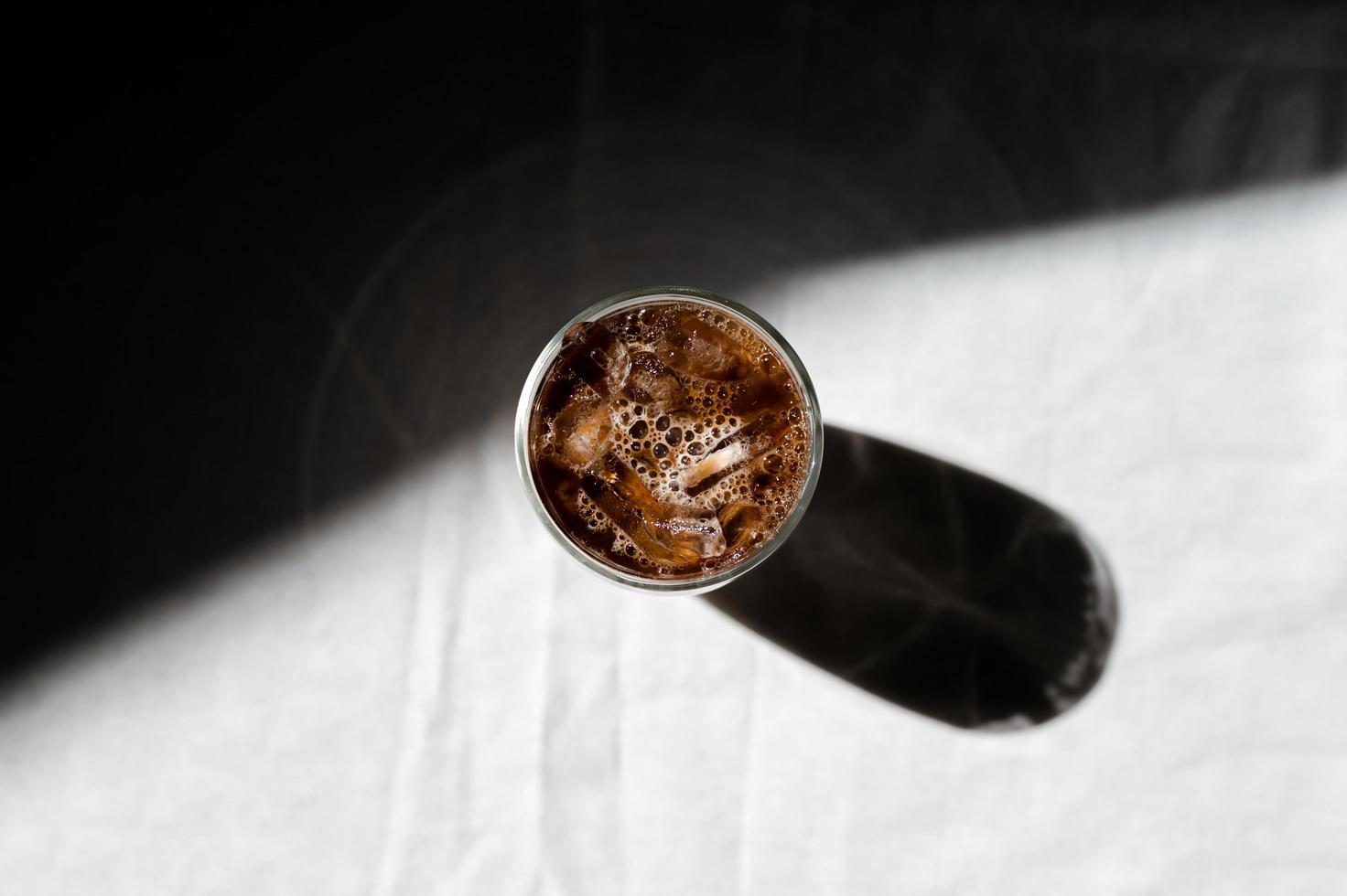 Top view of iced coffee with milk on the table photo