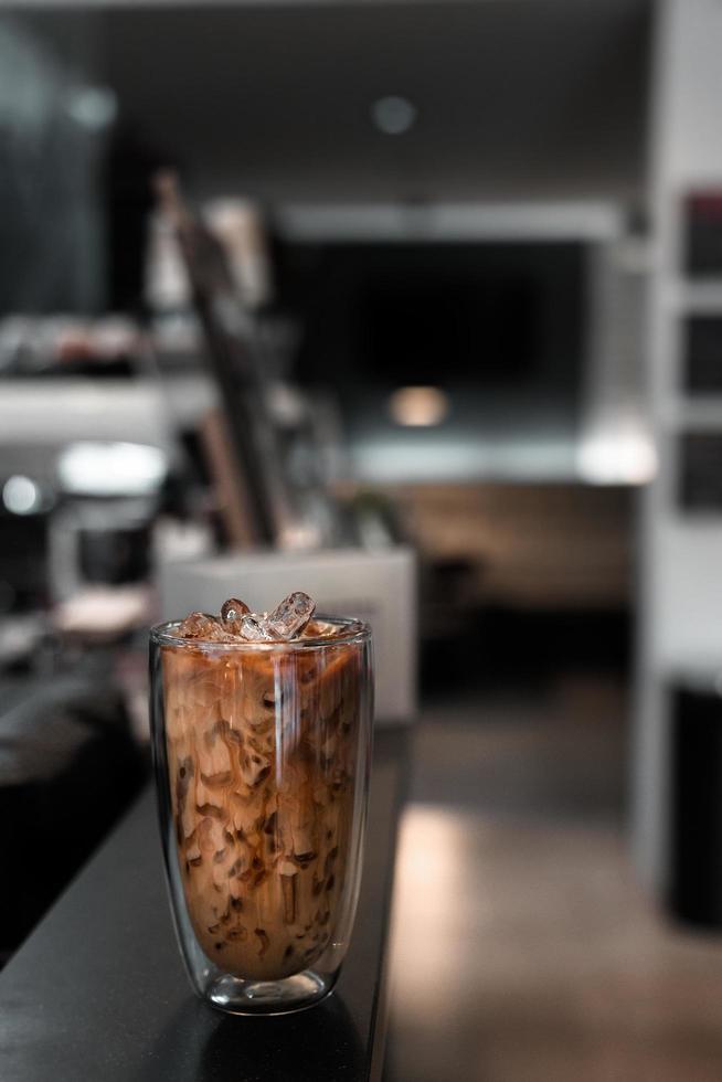 Iced coffee with milk on the table photo