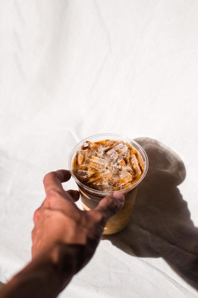 Close-up of a glass of iced coffee with milk photo