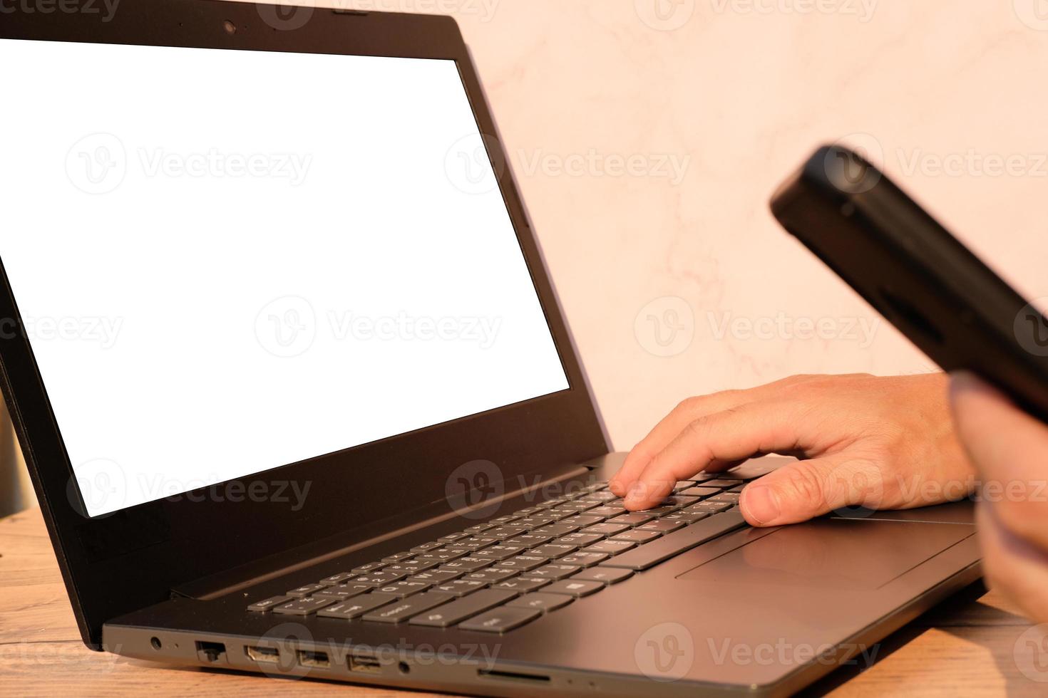 Businessman's hand working on laptop computer, technology concept photo