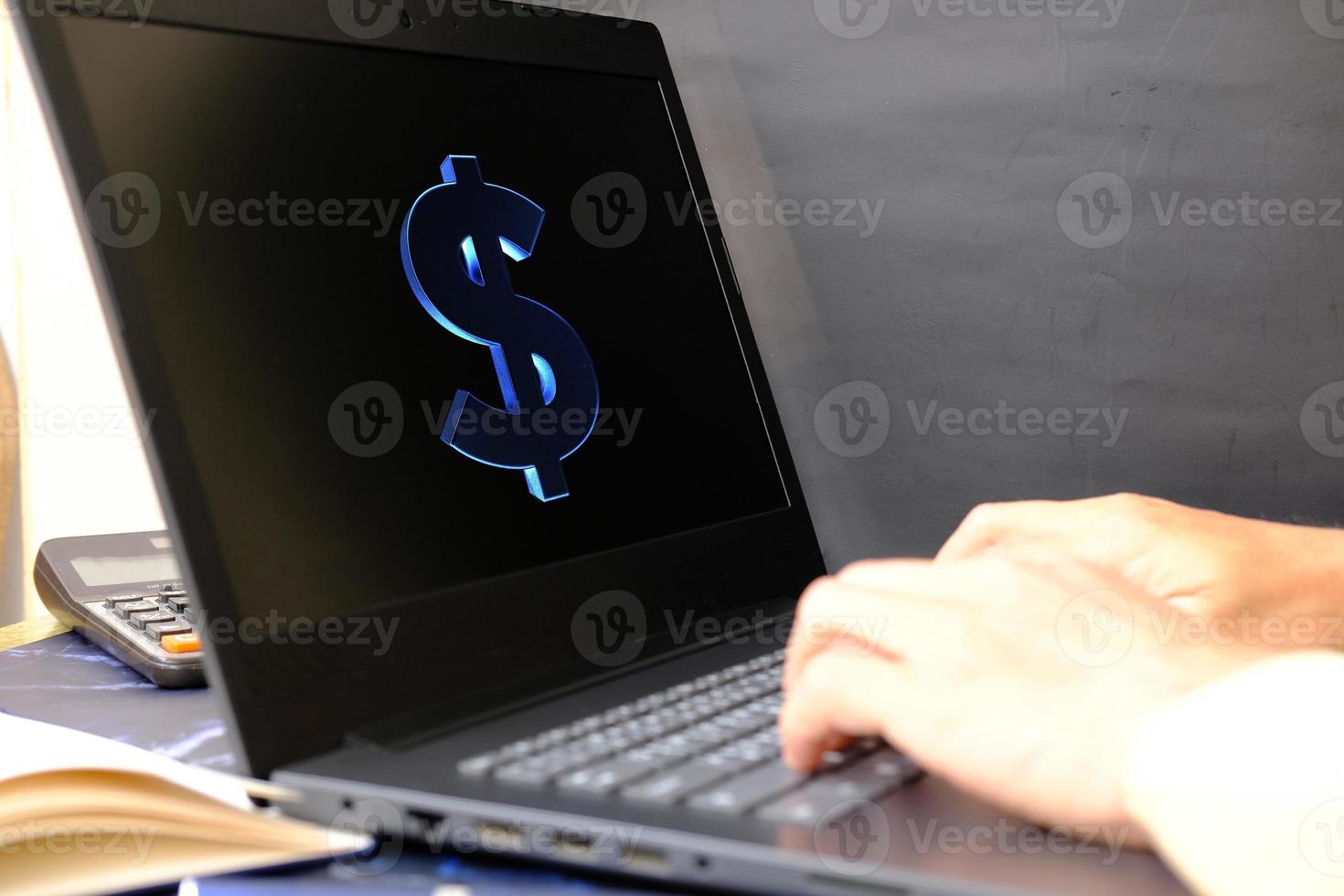 Businessman's hand working on laptop computer, technology concept photo