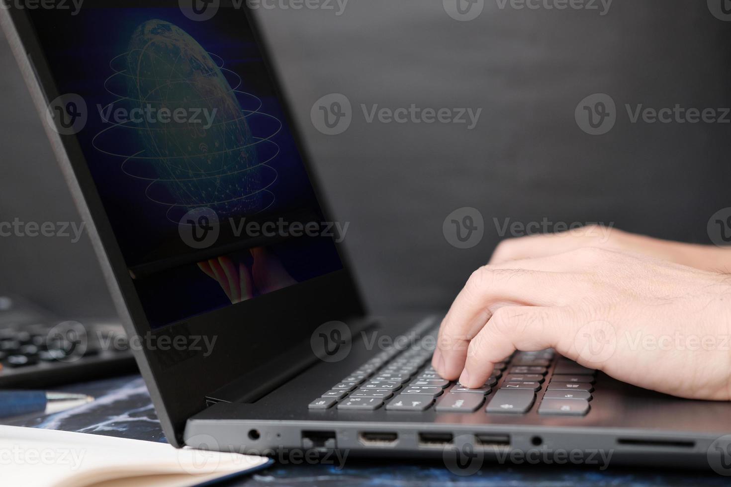 Businessman working on laptop computer and technology concept photo