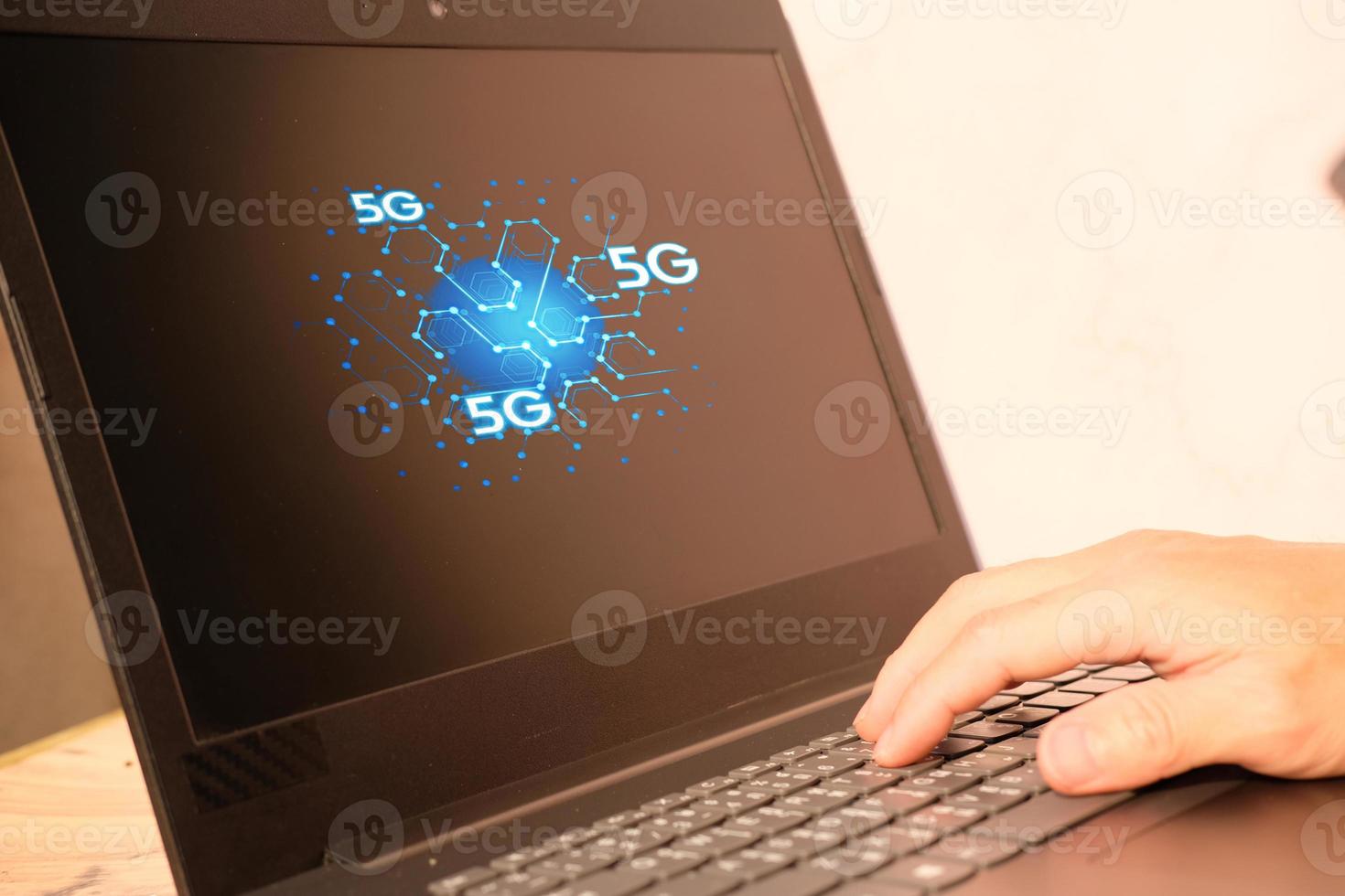 Businessman hand working on laptop computer and technology concept photo