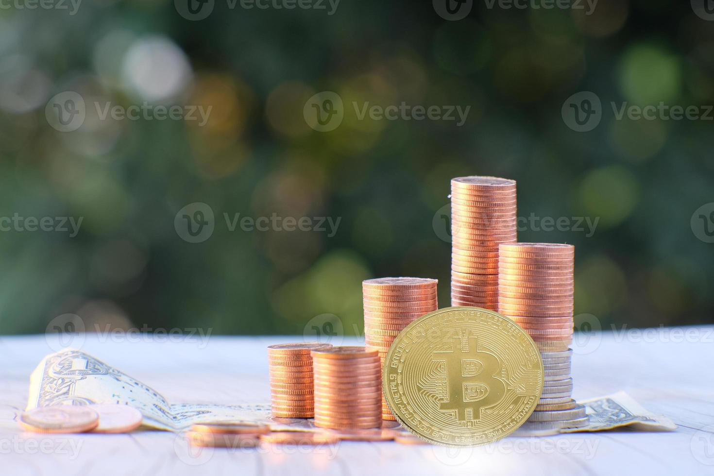 Bitcoin cryptocurrency coin and euro coin on table photo