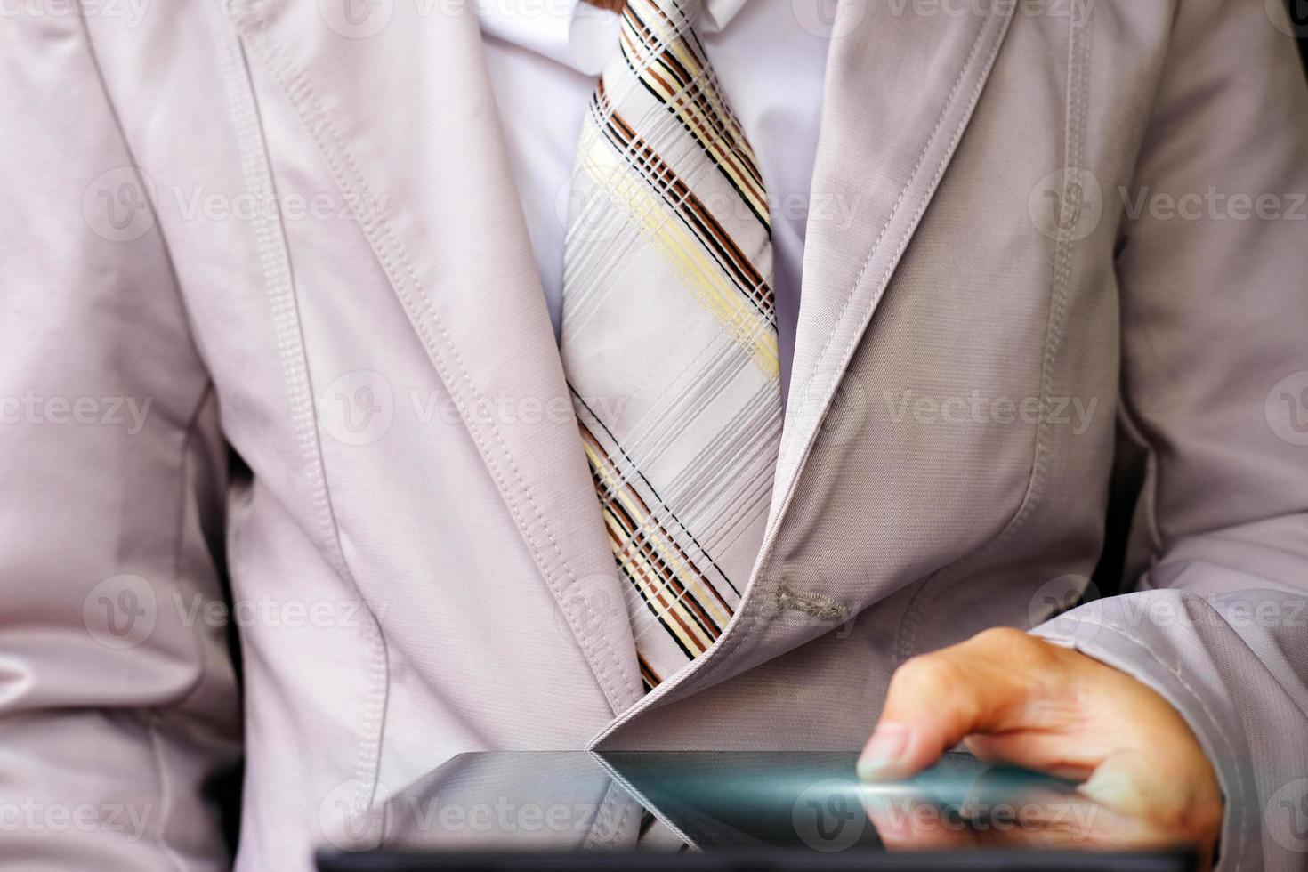 Businessman using a smartphone and technology network concepts photo